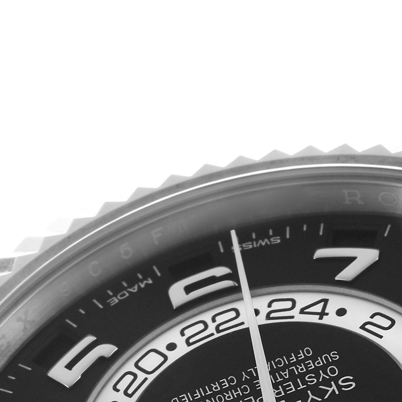 The image shows a close-up of the black dial and part of the bezel on a Rolex Sky-Dweller 326139 Men's White Gold Black Dial watch.