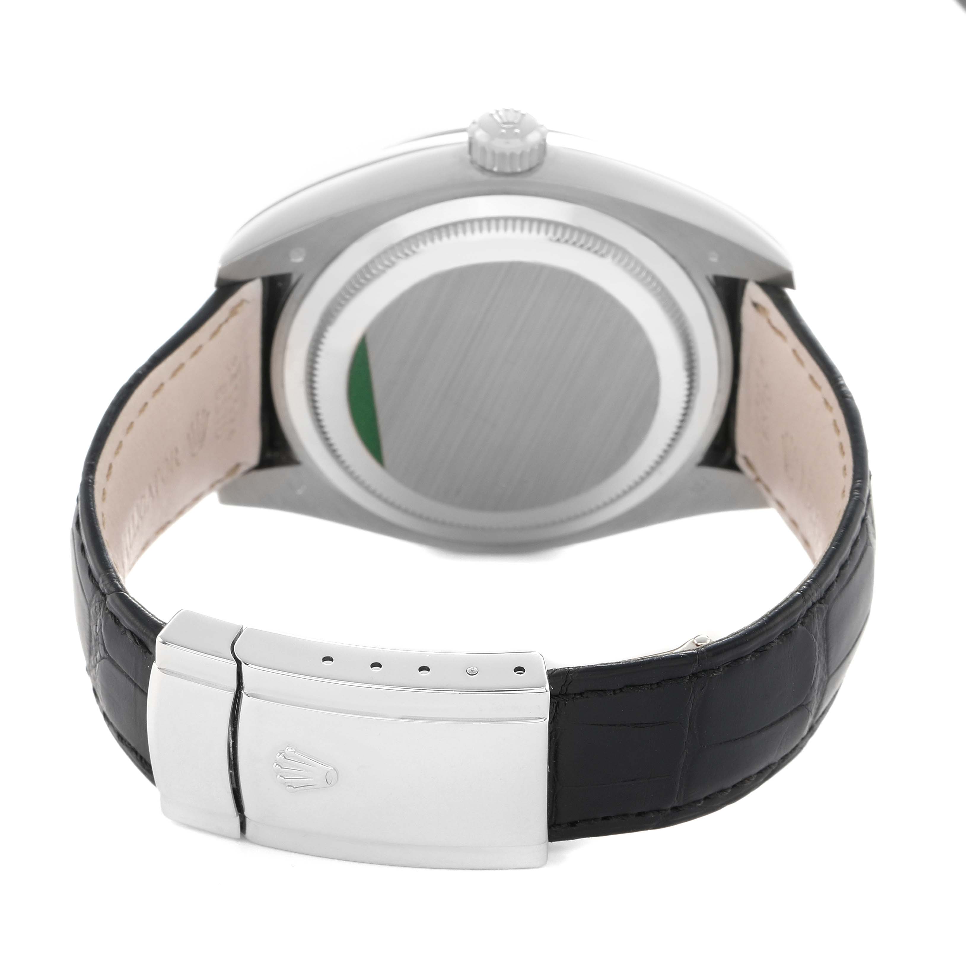 The image shows the back view of a Rolex Sky-Dweller 326139 Men's White Gold Black Dial, highlighting its clasp, leather strap, and case back.