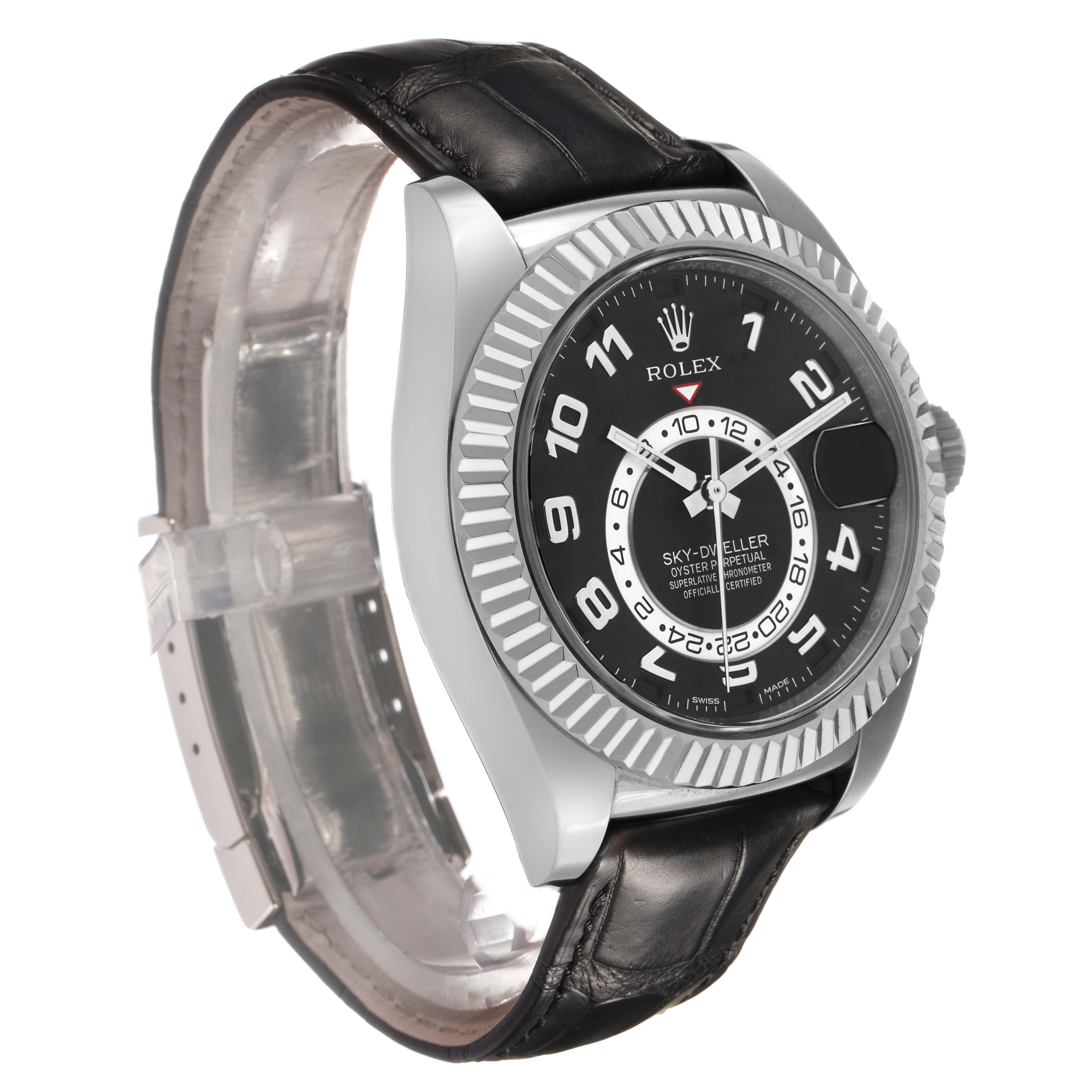 The Rolex Sky-Dweller 326139 Men's White Gold Black Dial watch is shown at a three-quarter angle, highlighting the dial, bezel, and leather strap.