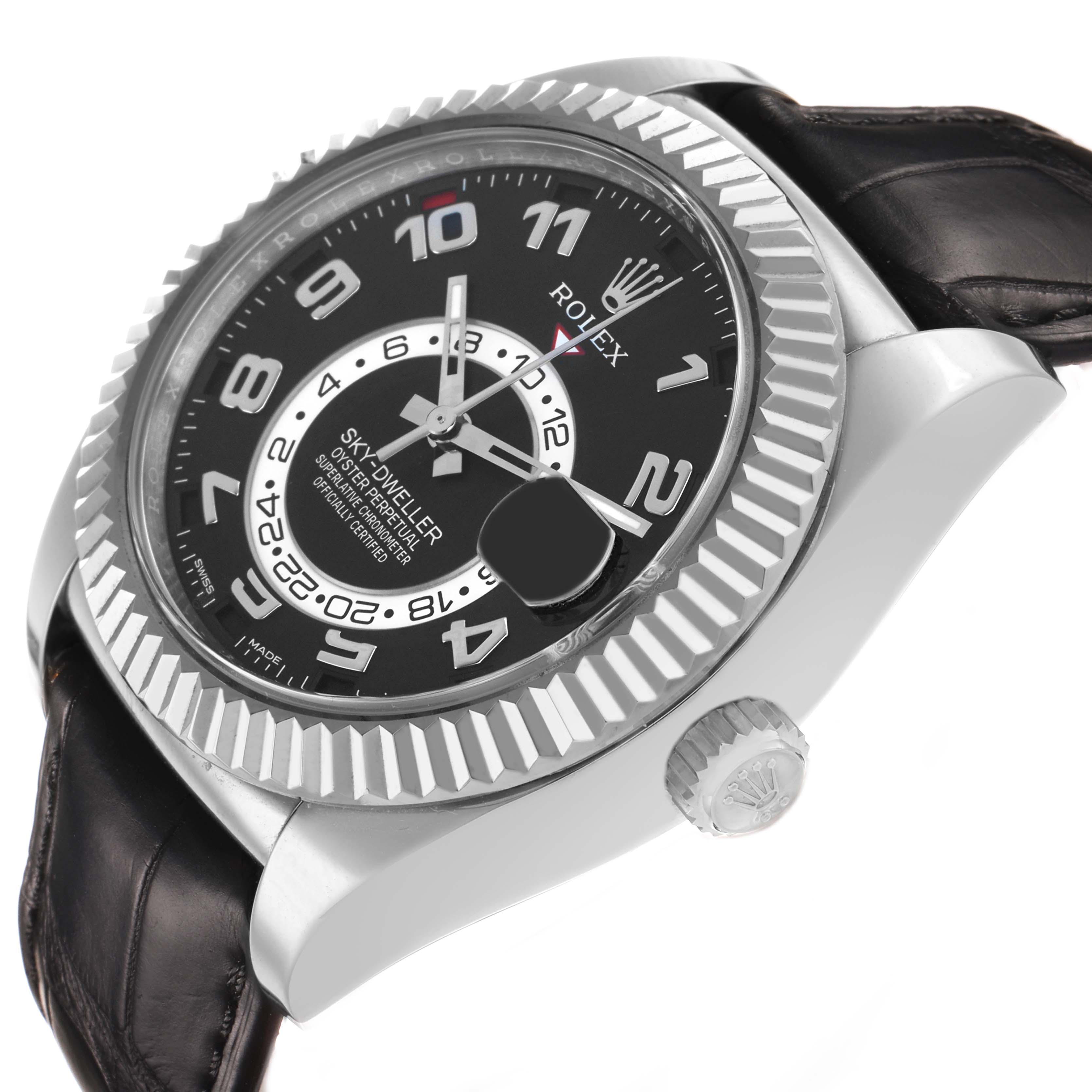 The Rolex Sky-Dweller 326139 Men's White Gold Black Dial watch is shown from a side angle, highlighting the bezel, dial, crown, and leather strap.