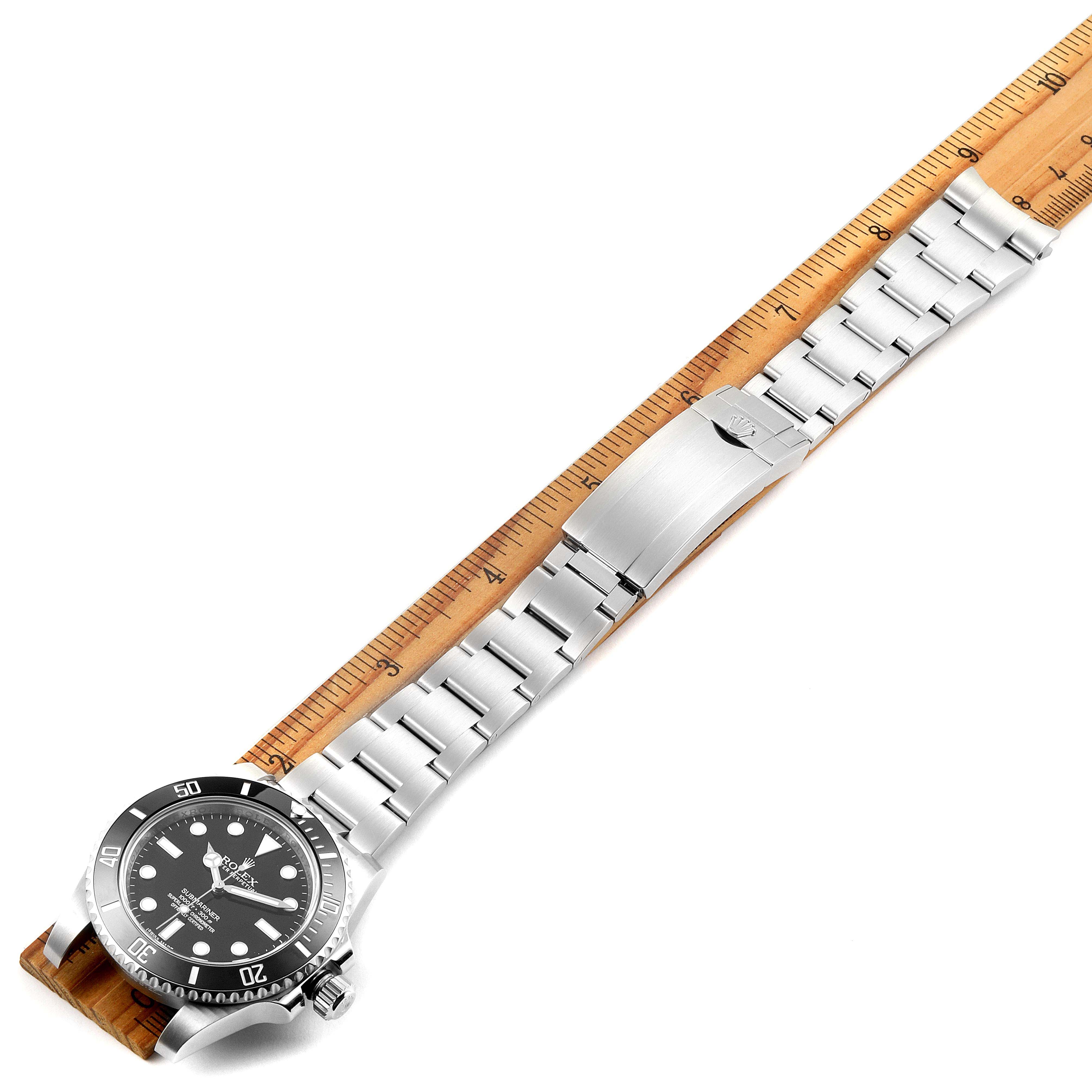 This image features a Rolex Submariner 114060 Men's Stainless Steel Black Dial 114060 Men's Stainless Steel Black Dial watch, showing the full bracelet and clasp, aligned along a ruler for measurement.