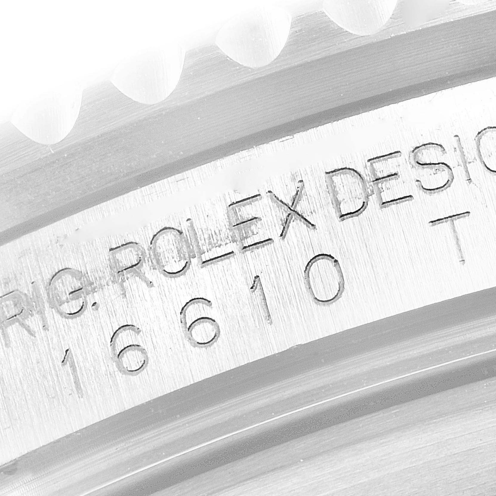 The image shows a close-up of the casing engraving on a Rolex Submariner 16610 Men
s Stainless Steel Black Dial 16610 Men
s Stainless Steel Black Dial model 16610.