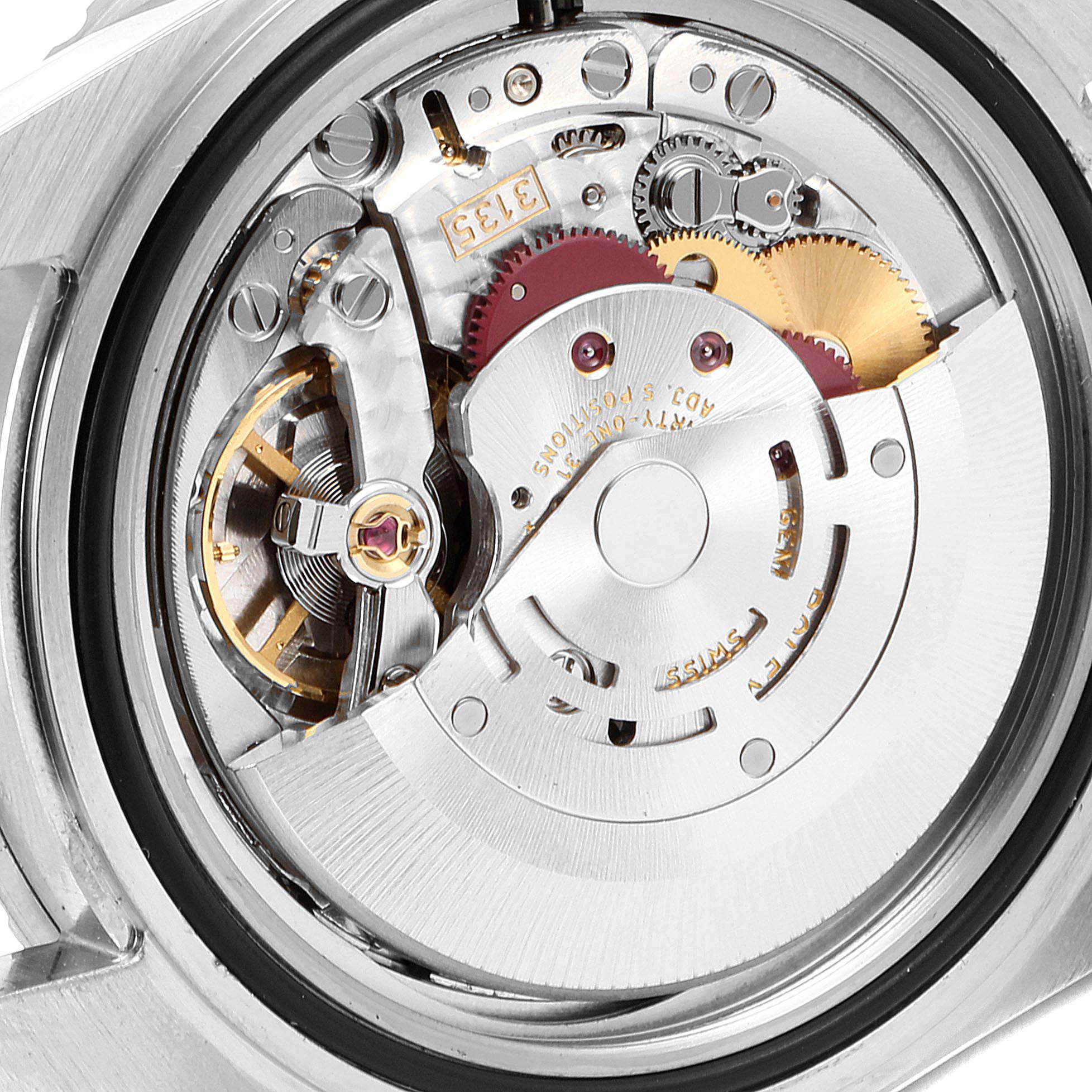 The image shows a close-up view of the internal movement of a Rolex Submariner 16610 Men
s Stainless Steel Black Dial 16610 Men
s Stainless Steel Black Dial watch.