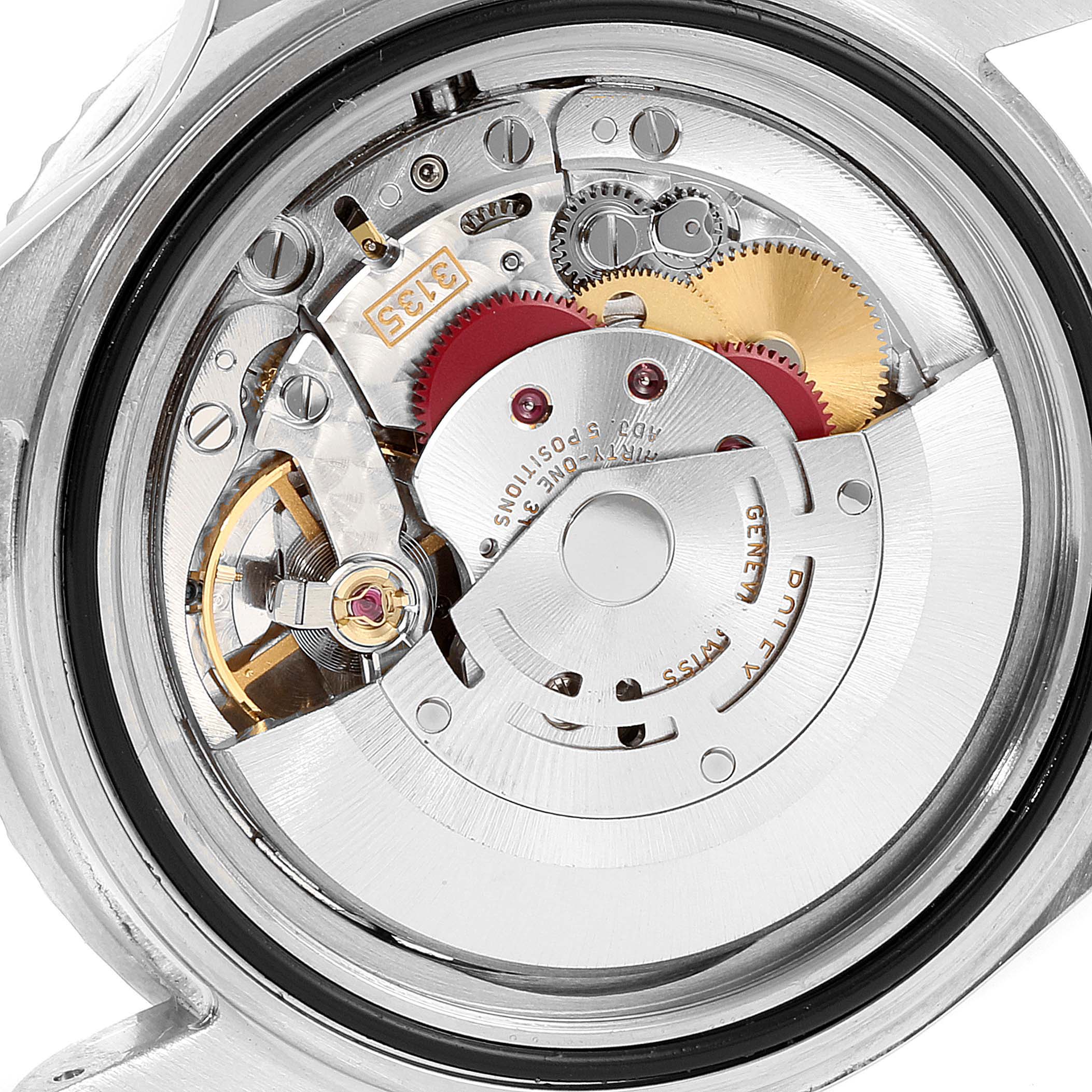 This close-up view of a Rolex Submariner 16610 Men
s Stainless Steel Black Dial 16610 Men
s Stainless Steel Black Dial watch reveals its intricate inner movement and mechanical components.