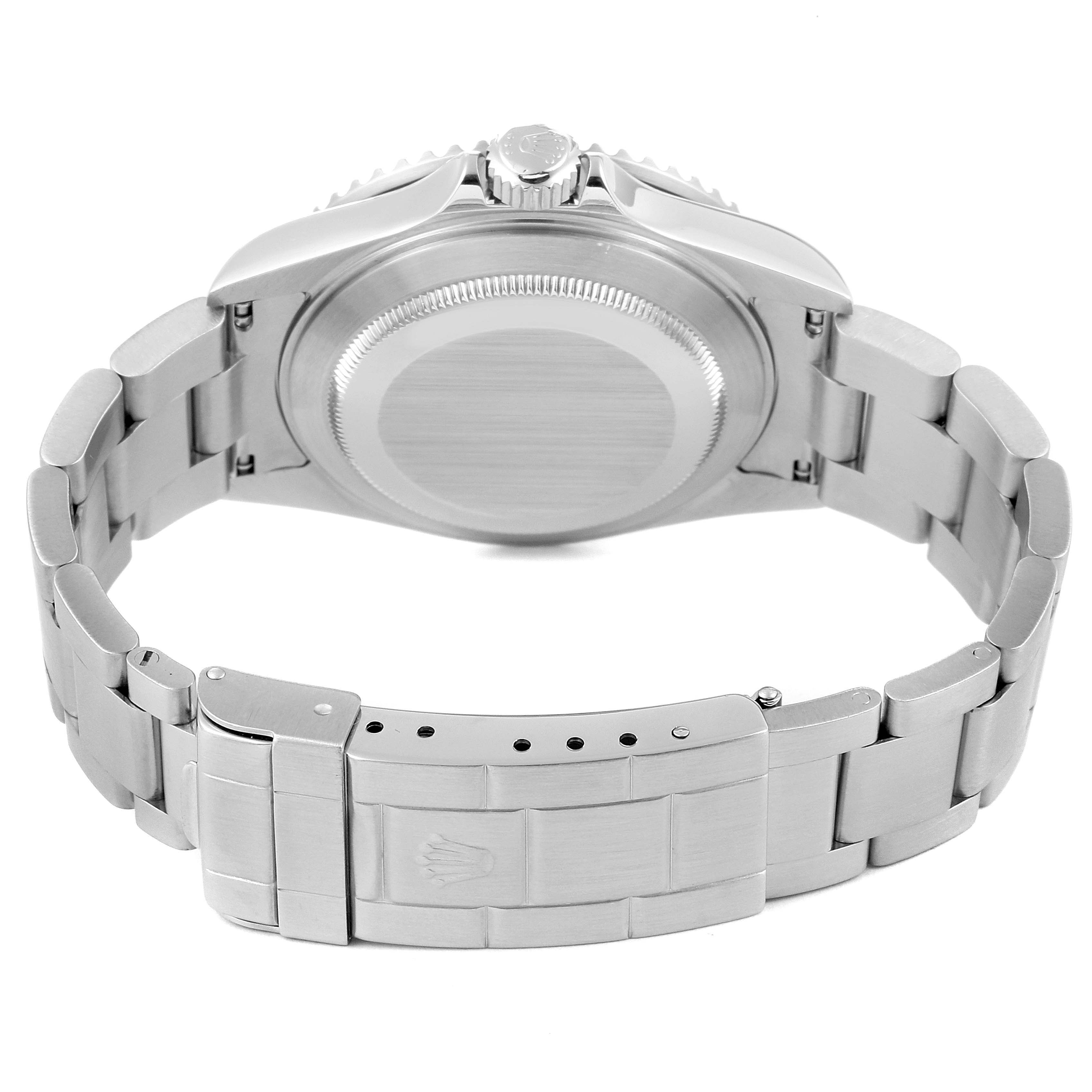 The image shows the back view and clasp of a Rolex Submariner 16610 Men
s Stainless Steel Black Dial 16610 Men
s Stainless Steel Black Dial watch, highlighting its metal bracelet and closed case back.