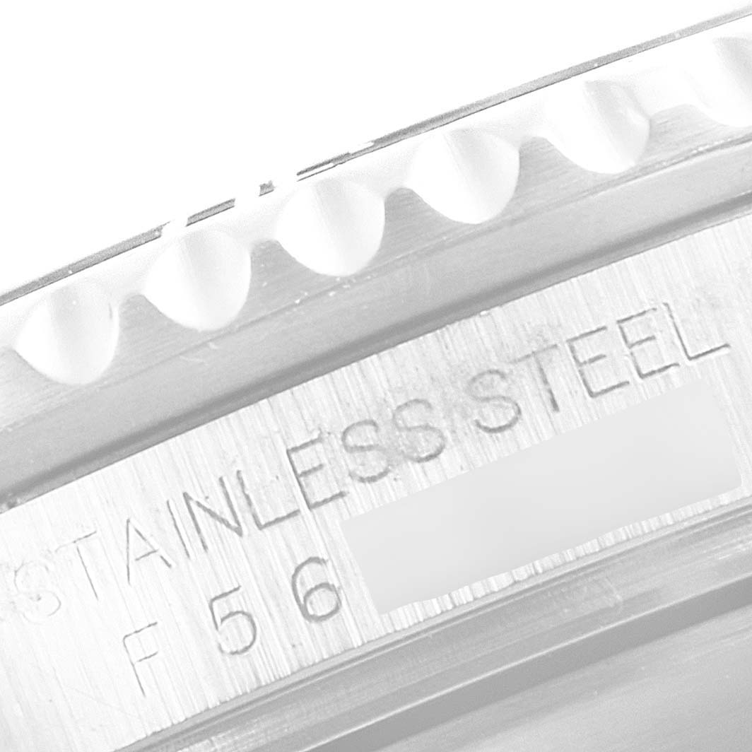 This close-up shows the bezel and engraved stainless steel case of a Rolex Submariner 16610 Men
s Stainless Steel Black Dial 16610 Men
s Stainless Steel Black Dial watch.