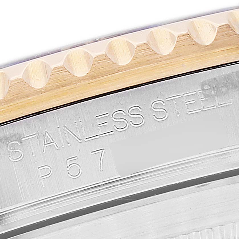 The image shows a close-up of the engraved case back of a Rolex Submariner 16613 Men's Steel and Gold (two tone) Blue Dial 16613 Men's Steel and Gold (two tone) Blue Dial, highlighting the "STAINLESS STEEL" text and part of the bezel.