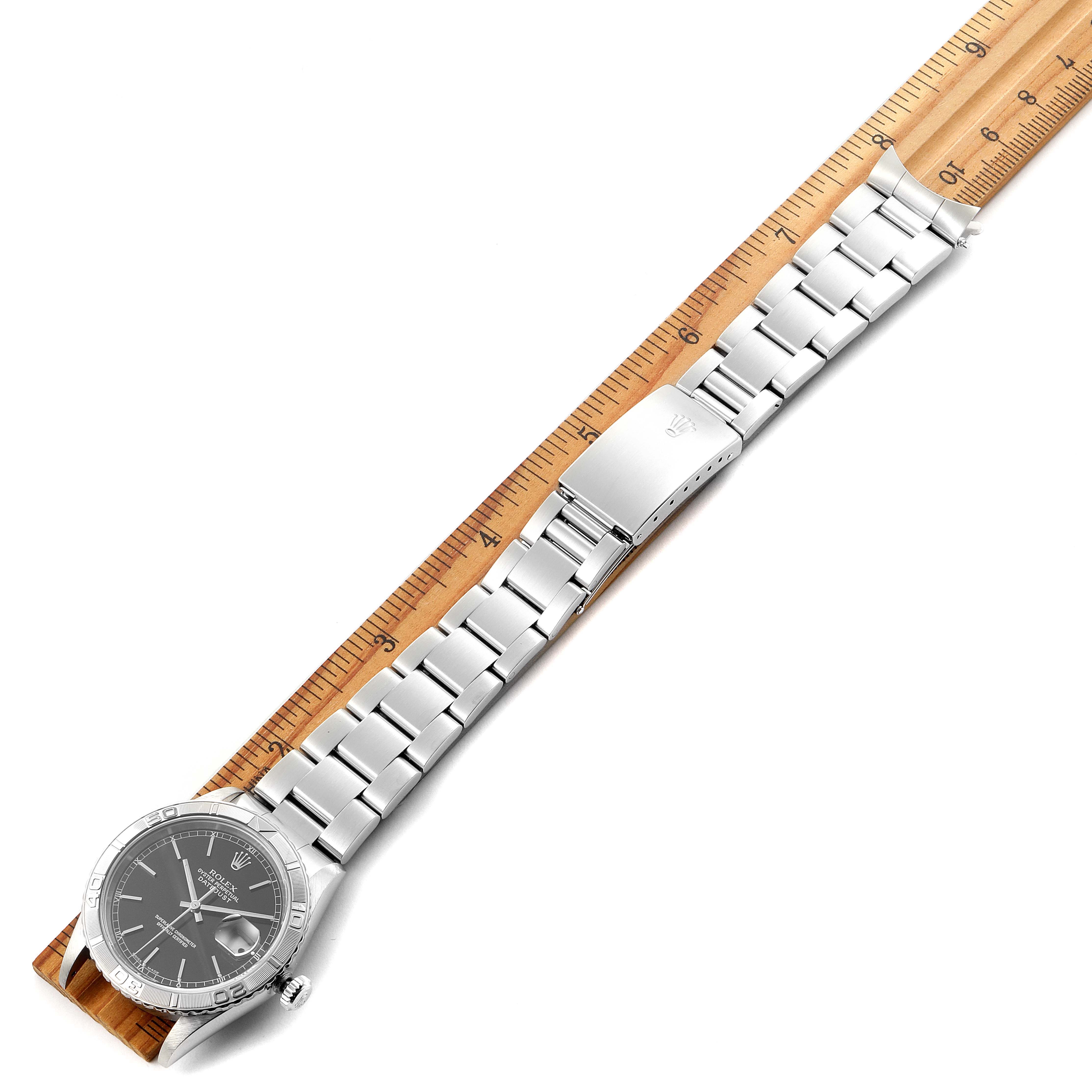 The image shows a top view of the Rolex Turn-o-Graph 16264 Men's Stainless Steel Black Dial 16264 Men's Stainless Steel Black Dial watch, highlighting the dial, bezel, bracelet, and clasp.