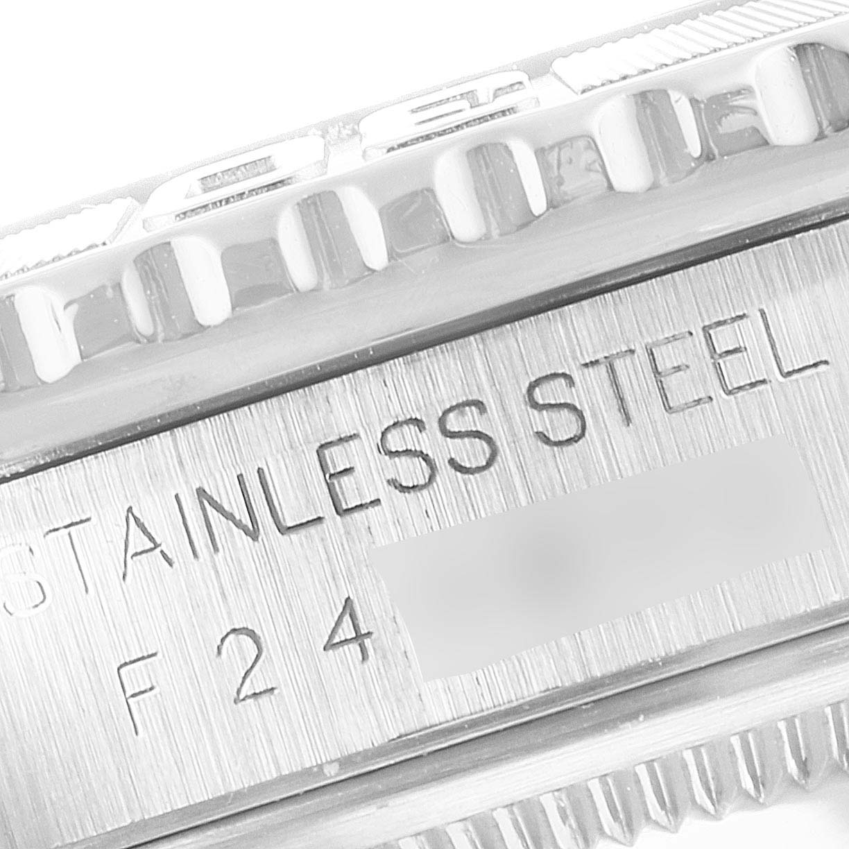 This is a close-up showing the band and part of the bezel of a Rolex Turn-o-Graph 16264 Men's Stainless Steel Black Dial 16264 Men's Stainless Steel Black Dial model, focusing on the "STAINLESS STEEL" engraving.