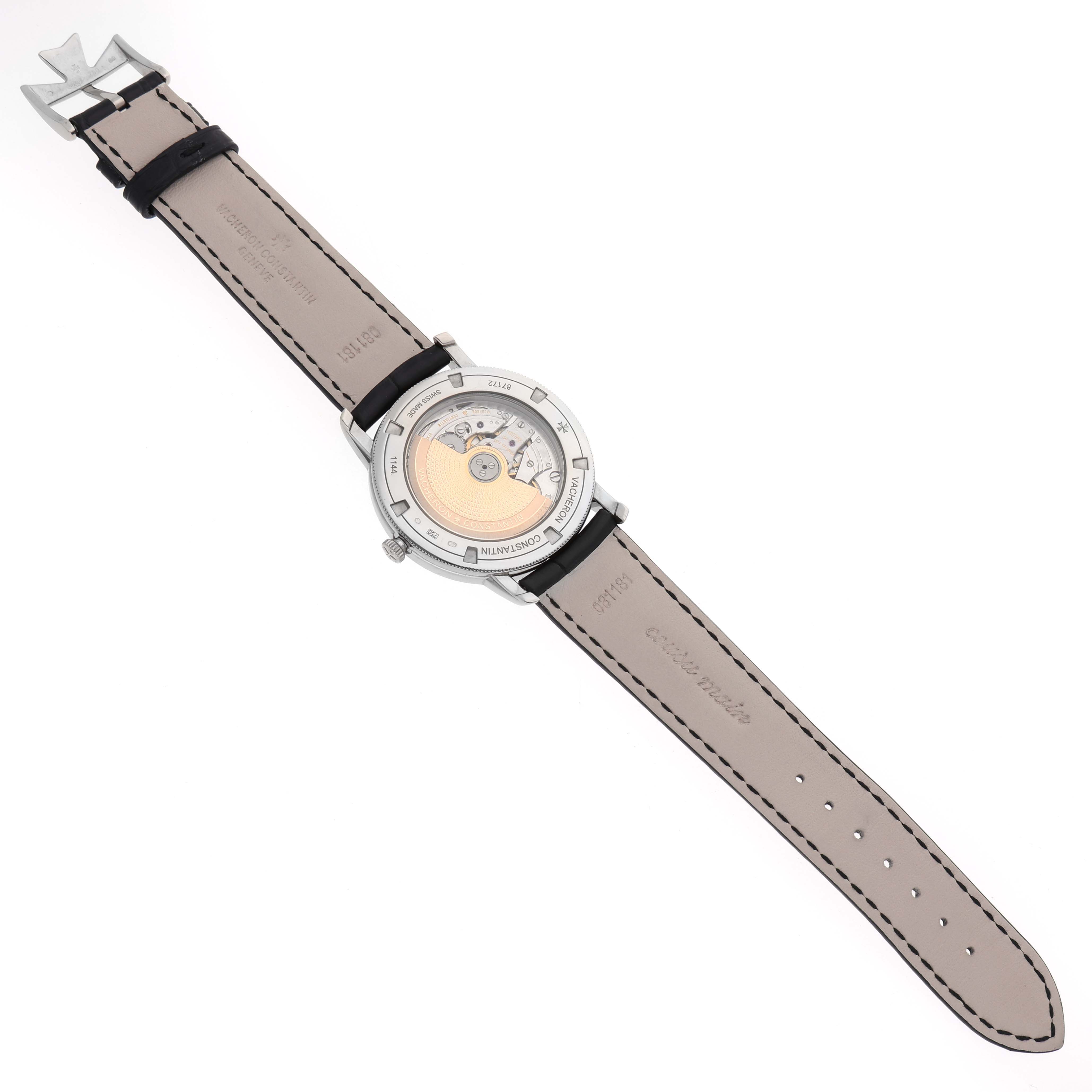 The Vacheron Constantin Traditionnelle 87172 Men's White Gold Silver Dial watch is shown from the back, highlighting its movement and leather strap.