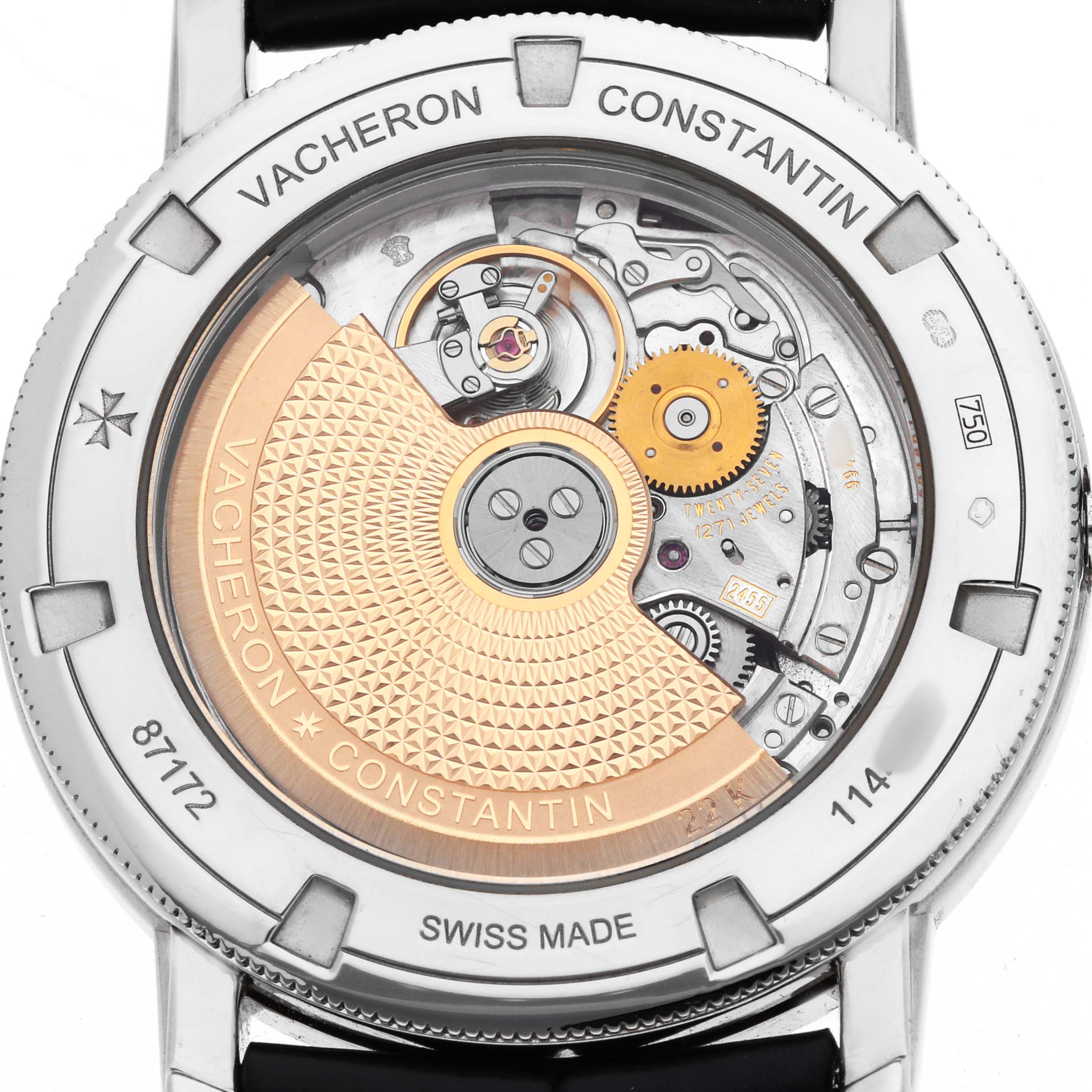 The image shows the back of a Vacheron Constantin Traditionnelle 87172 Men's White Gold Silver Dial watch, highlighting its movement and intricate rotor design.