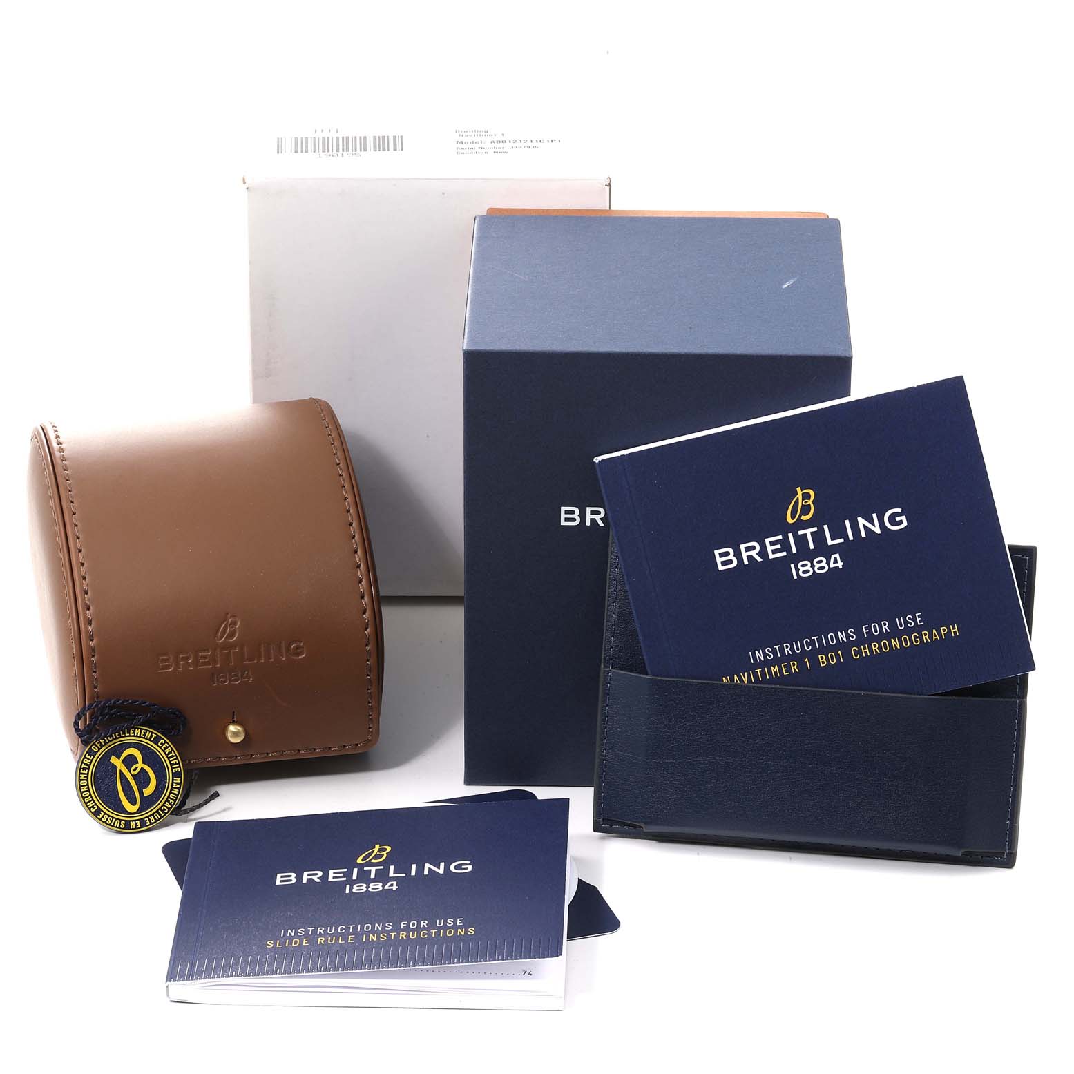 The image shows the packaging, instruction booklets, and a leather case for a Breitling Navitimer AB0121C4-C920-731P Men
s Stainless Steel Blue Dial AB0121C4-C920-731P Men
s Stainless Steel Blue Dial model.