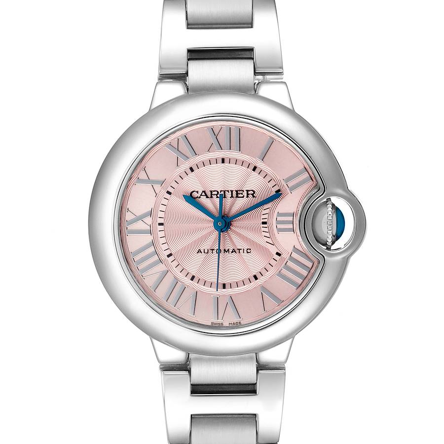 The Cartier Ballon Bleu W6920100 Women's Stainless Steel Pink Dial watch is shown from a frontal angle, highlighting its pink dial, Roman numerals, and crown with blue cabochon.