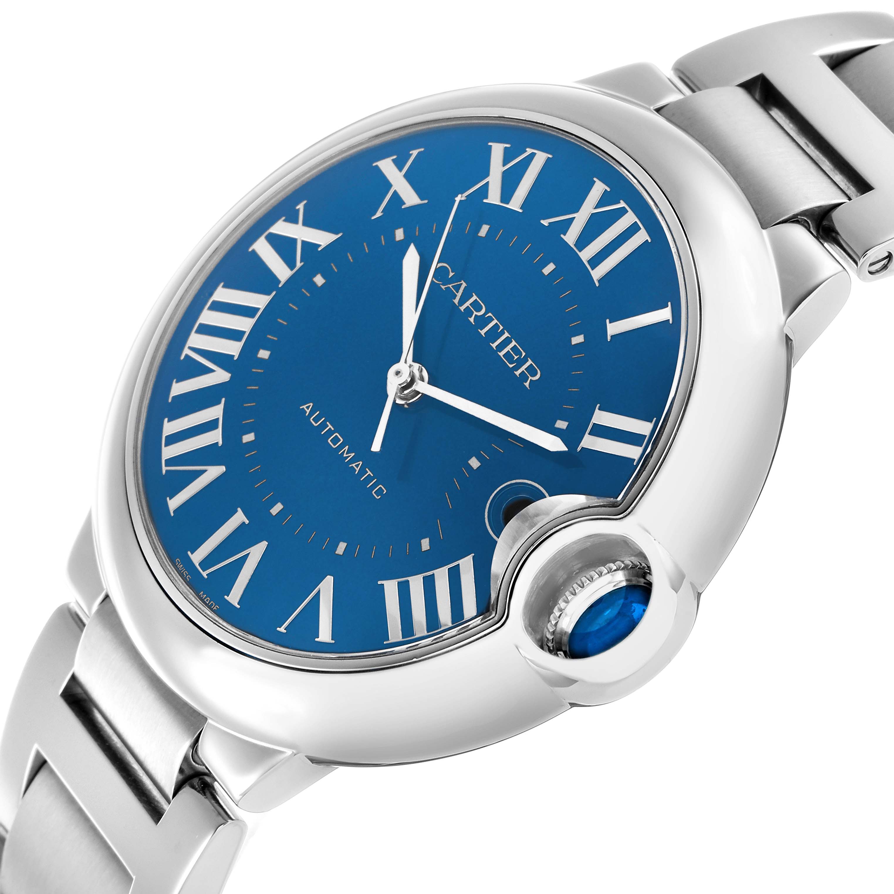 The Cartier Ballon Bleu WSBB0061 Men's Stainless Steel Blue Dial watch is shown at a close angle, highlighting its blue dial, silver Roman numerals, and signature crown.