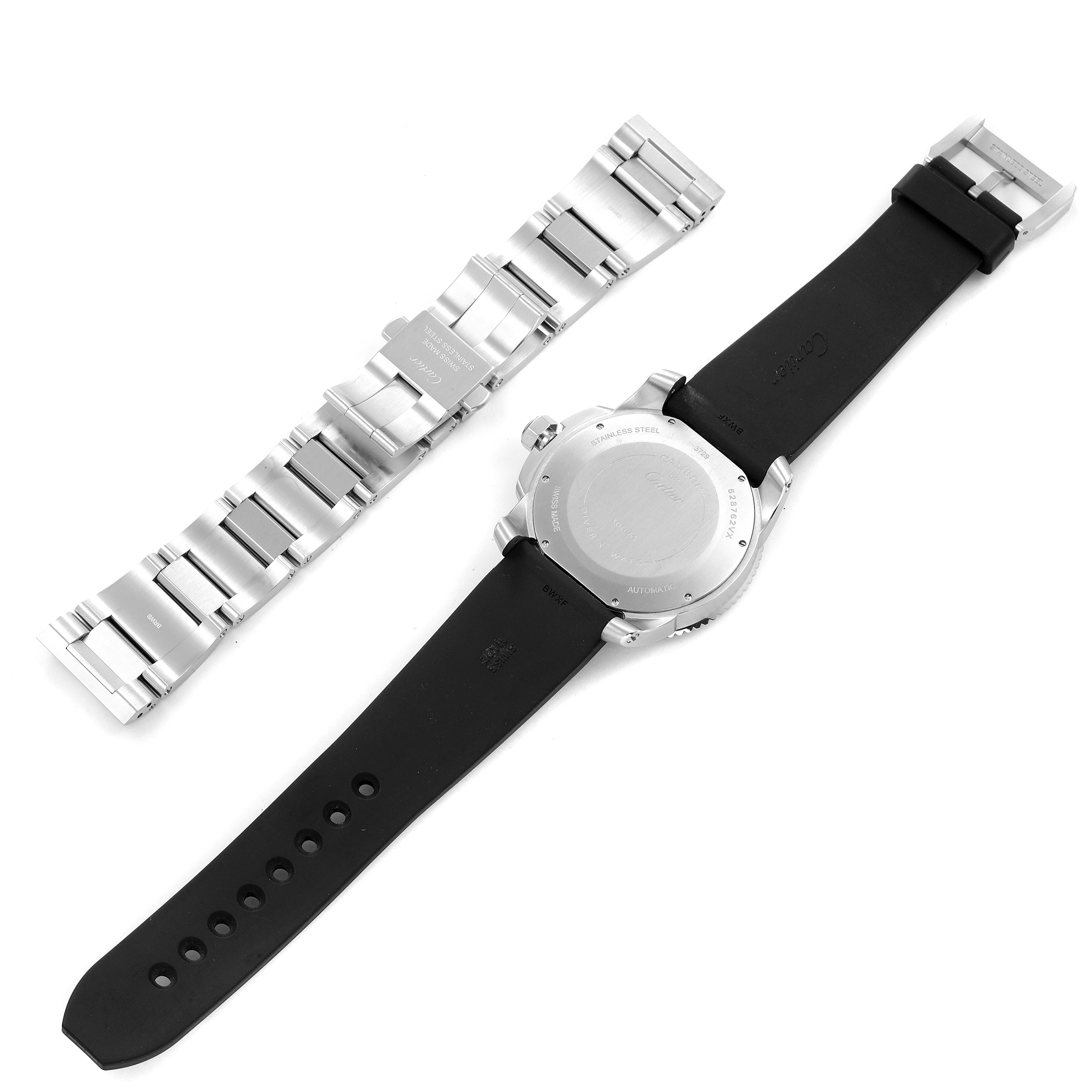 The image shows the back of a Calibre de Cartier watch by Cartier with a black strap and a separate stainless steel bracelet.