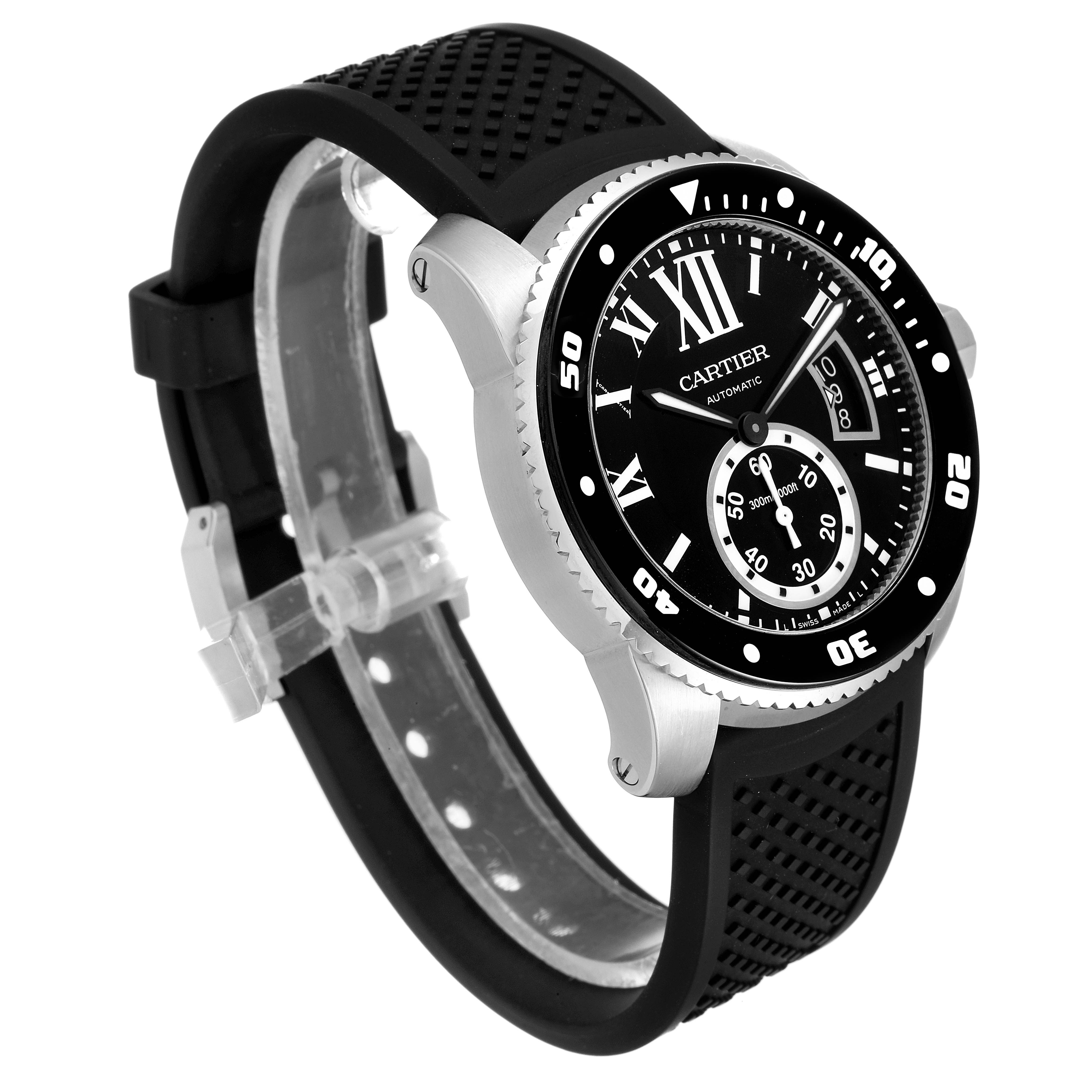 The Calibre de Cartier watch by Cartier is shown at a three-quarter angle displaying the dial, case, and black rubber strap.