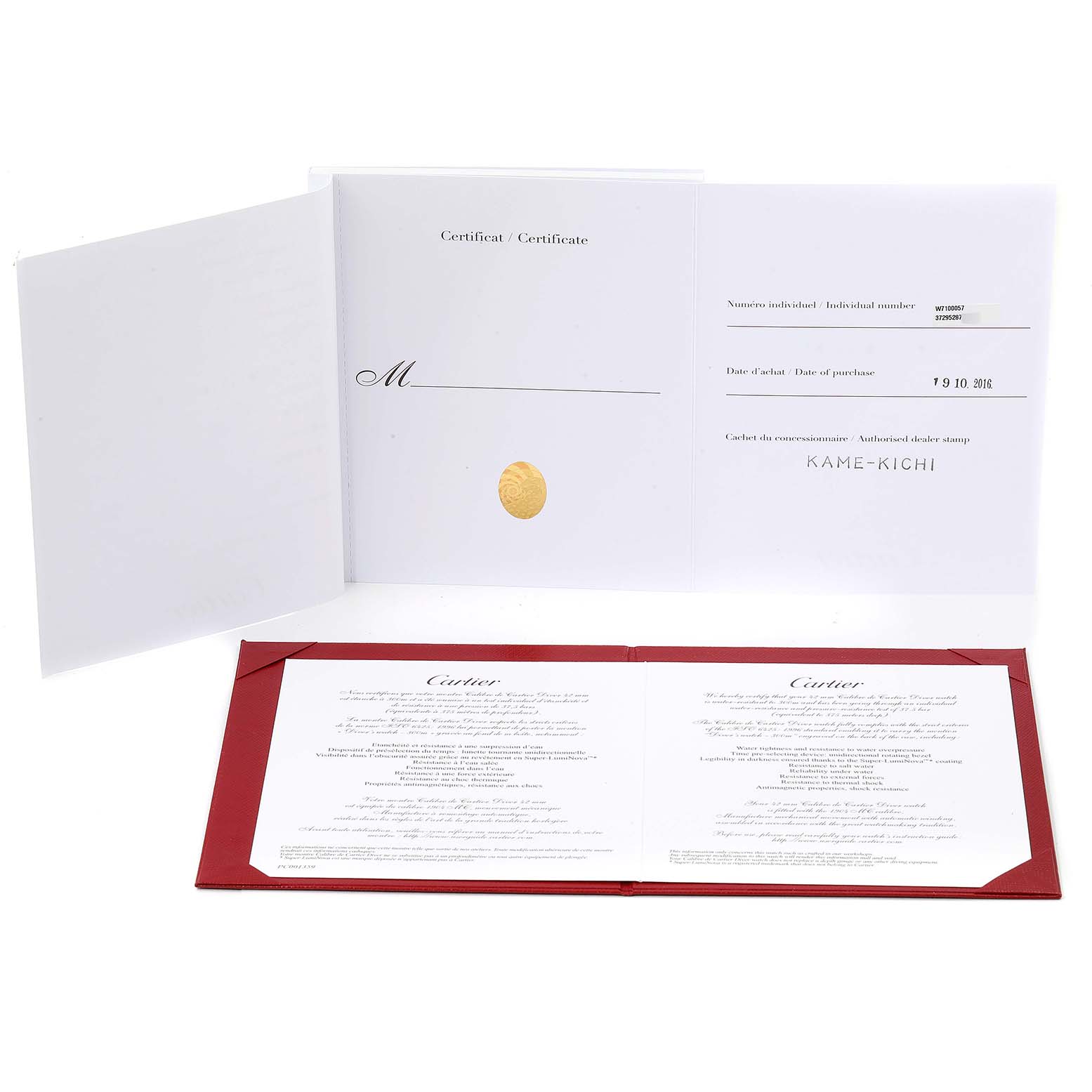 This image displays the certification and paperwork for a Calibre de Cartier watch by Cartier, shown open on a flat surface.