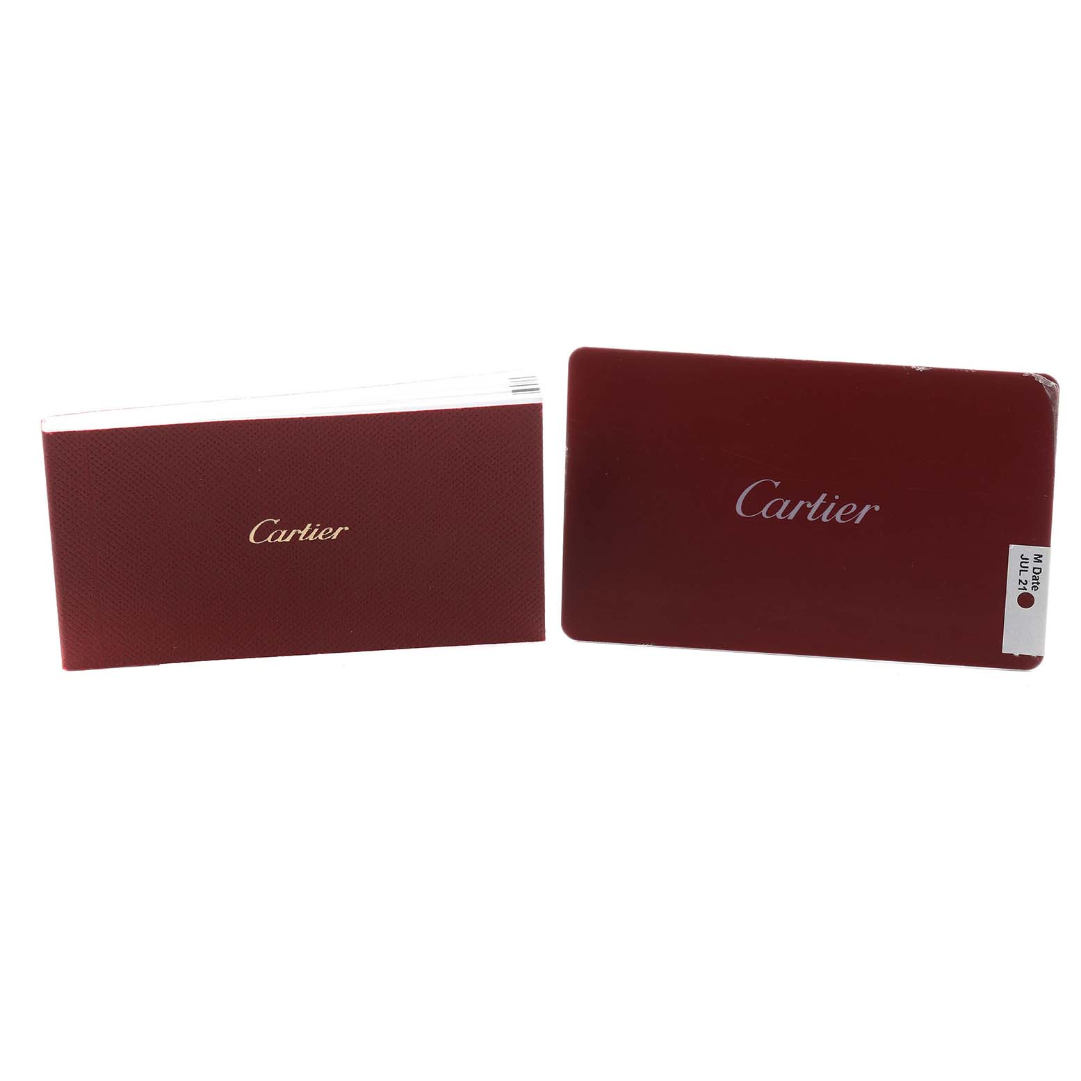 The image shows Cartier Cle W4CL0006 Women's Stainless Steel Silver Dial model watch accessories, specifically a red booklet and card with Cartier branding.