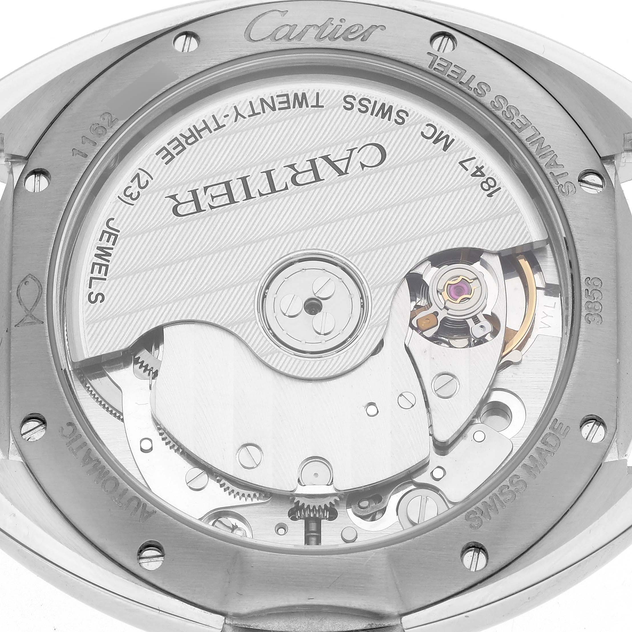 The image shows the back of a Cartier Clé watch, highlighting its automatic movement and intricate inner workings.