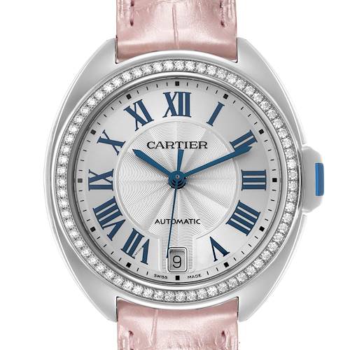 The Cartier Clé watch is shown from the front, highlighting the face, Roman numeral markers, and date window.