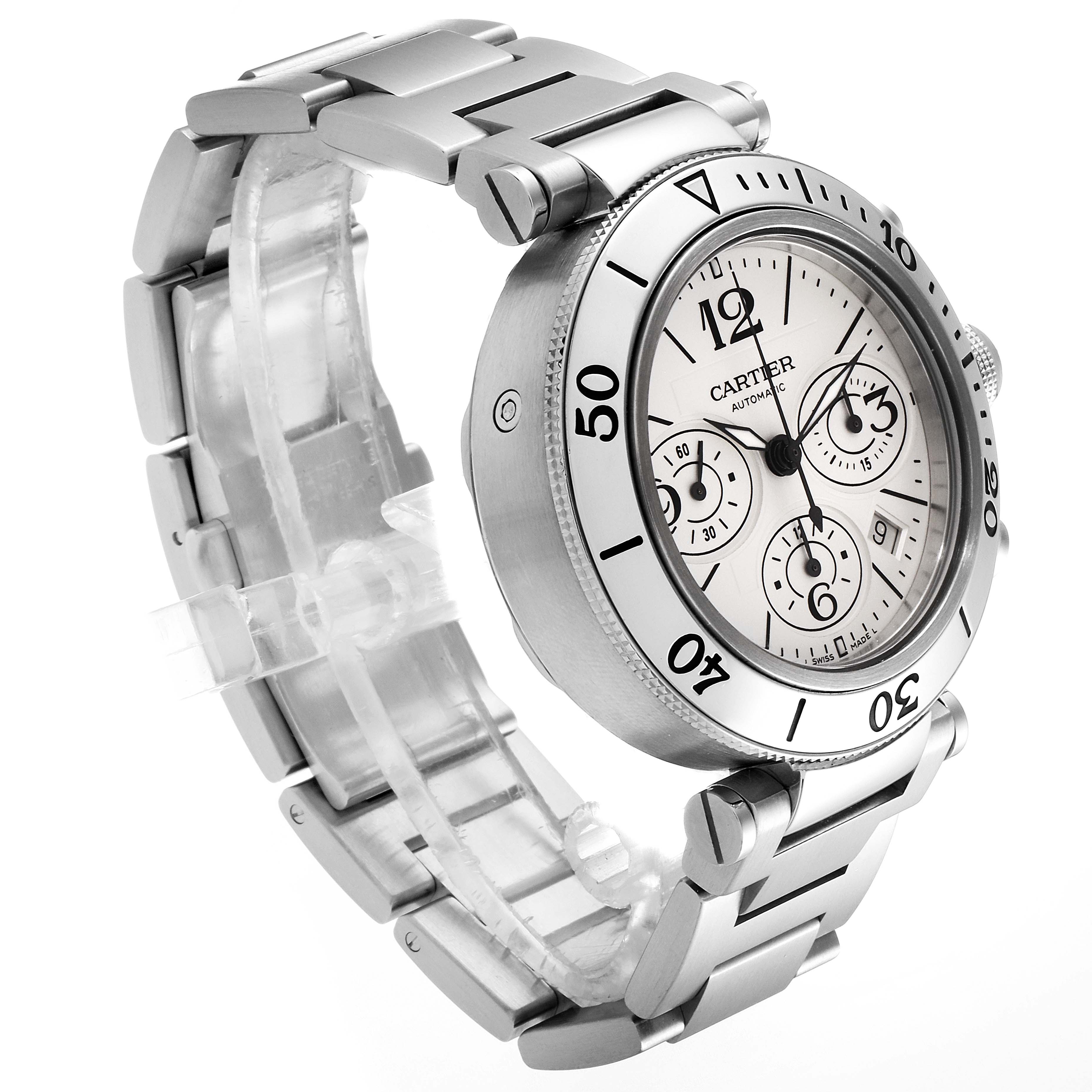 The image shows a Cartier Pasha W31089M7 Men's Stainless Steel Silver Dial W31089M7 Men's Stainless Steel Silver Dial watch at an angle highlighting its face, bezel, crown, and bracelet.