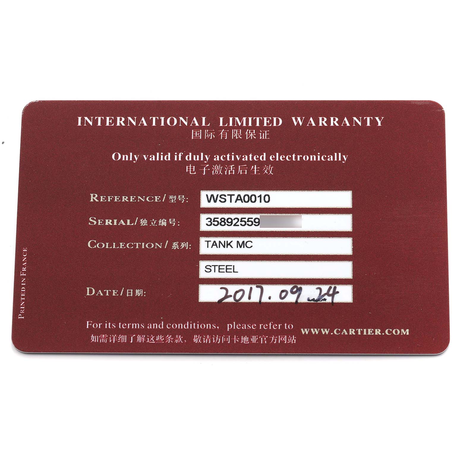 The image shows a Cartier Tank MC WSTA0010 Men's Stainless Steel Blue Dial model warranty card, detailing the reference, serial number, and date.