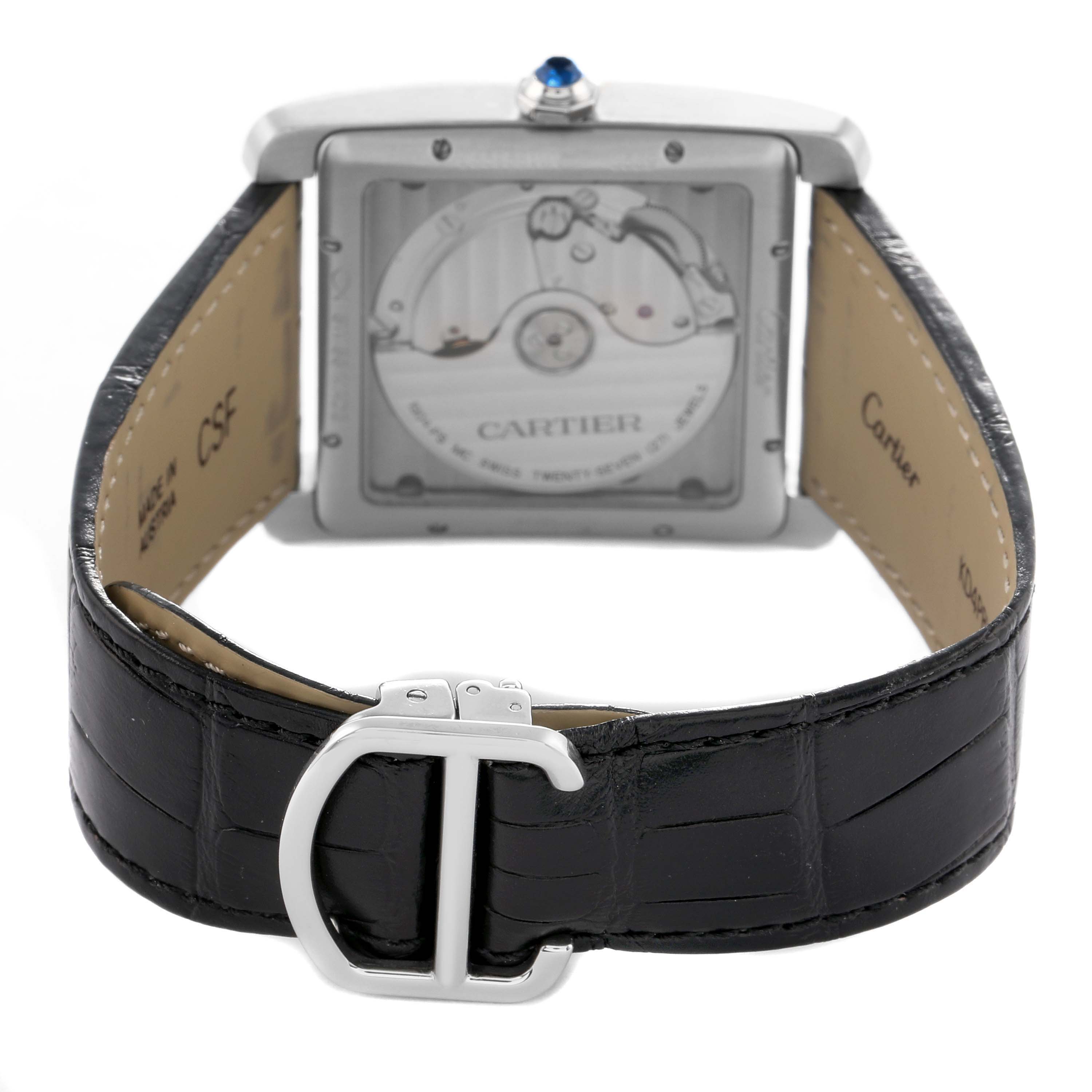 The image shows the back view of a Cartier Tank MC WSTA0010 Men's Stainless Steel Blue Dial watch, highlighting the movement and the leather strap with its buckle.