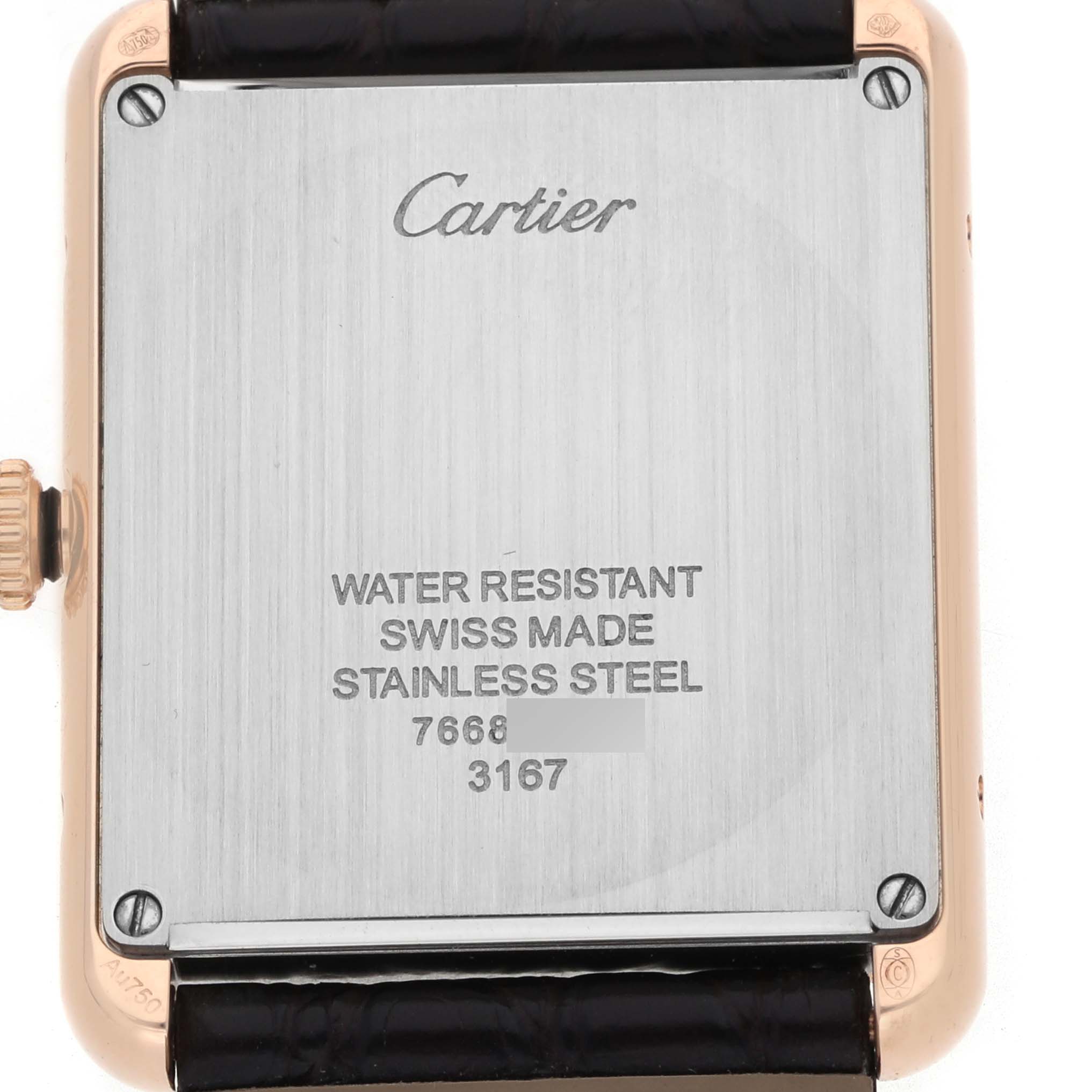 The image shows the back of a Cartier Tank Solo W5200025 Men's Steel and Gold (two tone) Silver Dial watch with engravings and part of the strap visible.