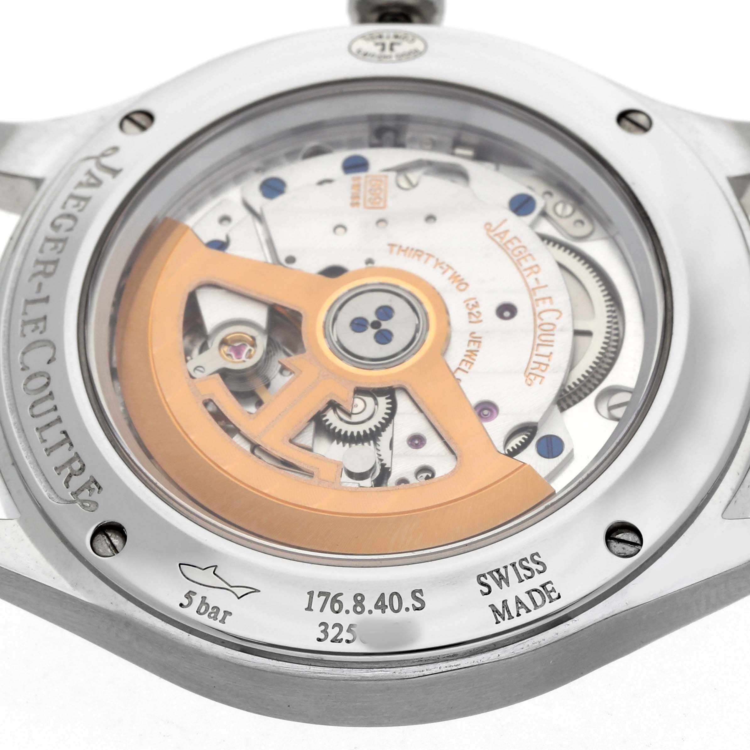 The image shows the back of a Jaeger-LeCoultre Master watch, revealing its exposed movement and rotor.