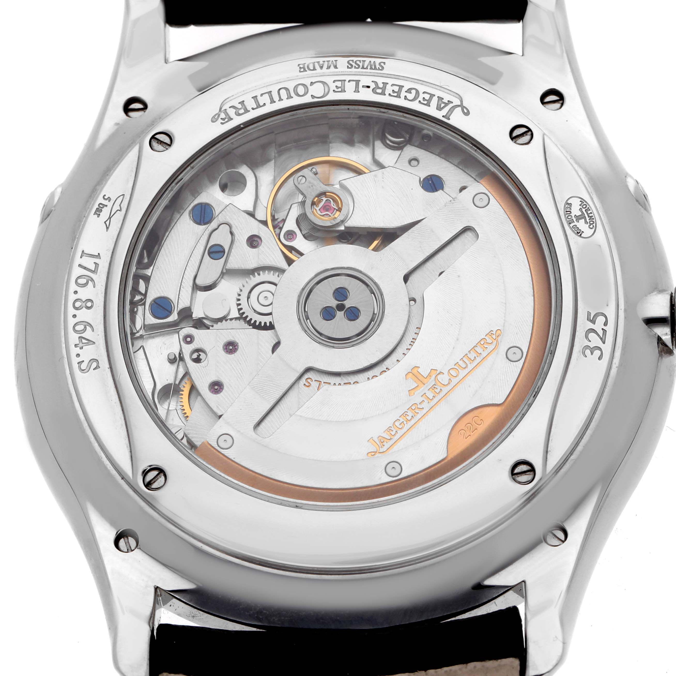 The image shows the back of a Jaeger-LeCoultre Master watch, revealing its intricate mechanical movement.