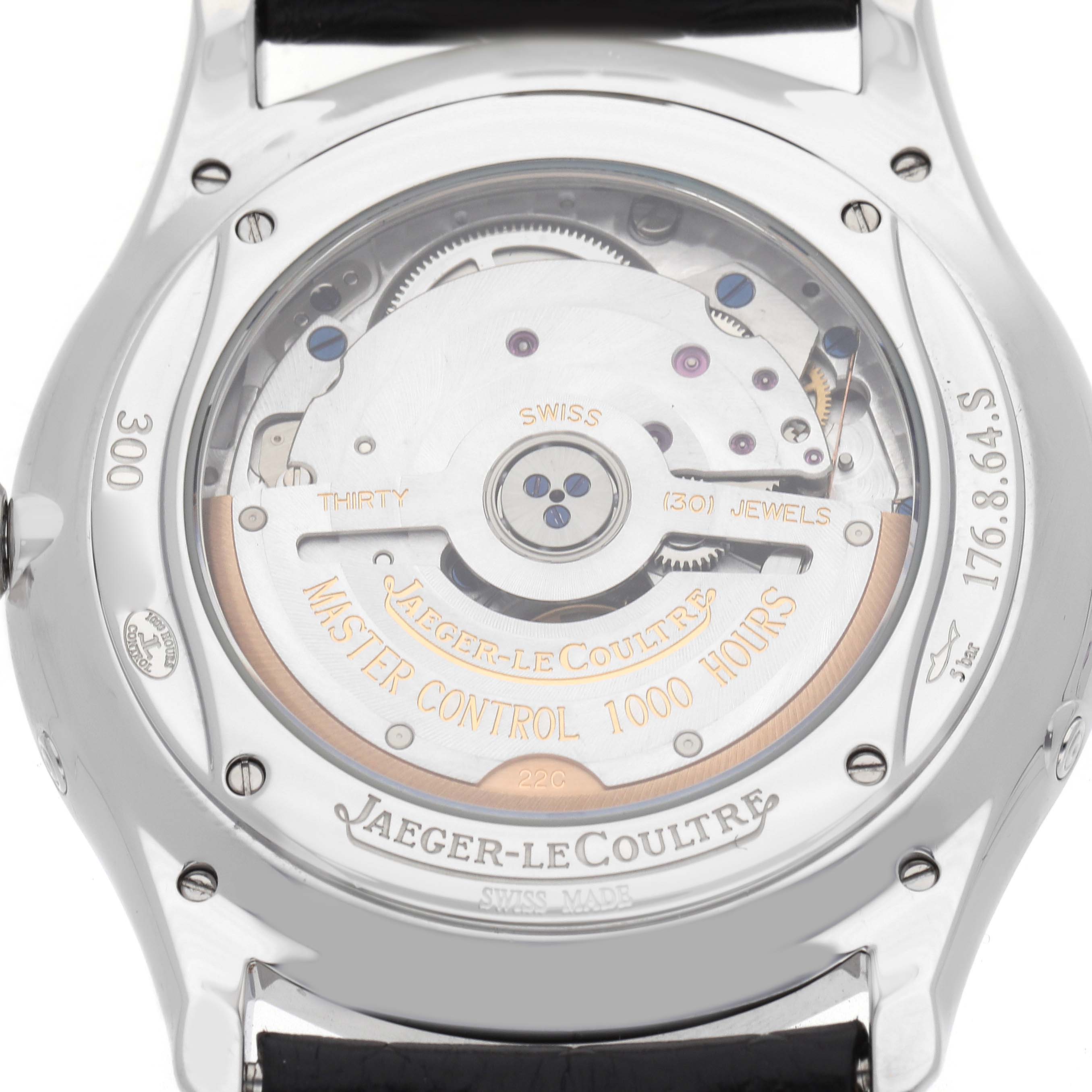 The image shows the back of a Jaeger-LeCoultre Master model, highlighting its movement and inscriptions through a transparent case back.