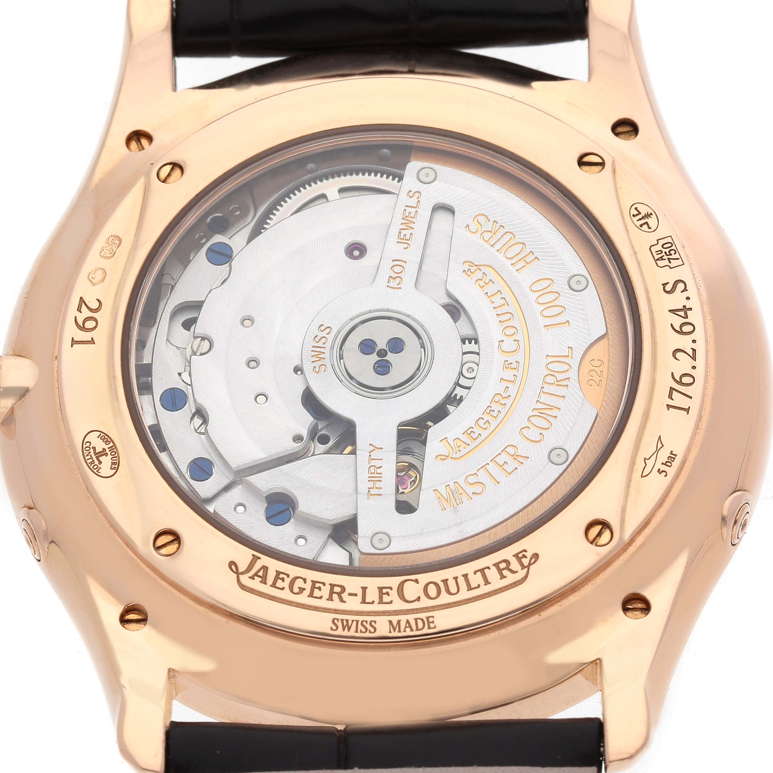The image shows the back of the Jaeger-LeCoultre Master watch, revealing the movement and engravings.