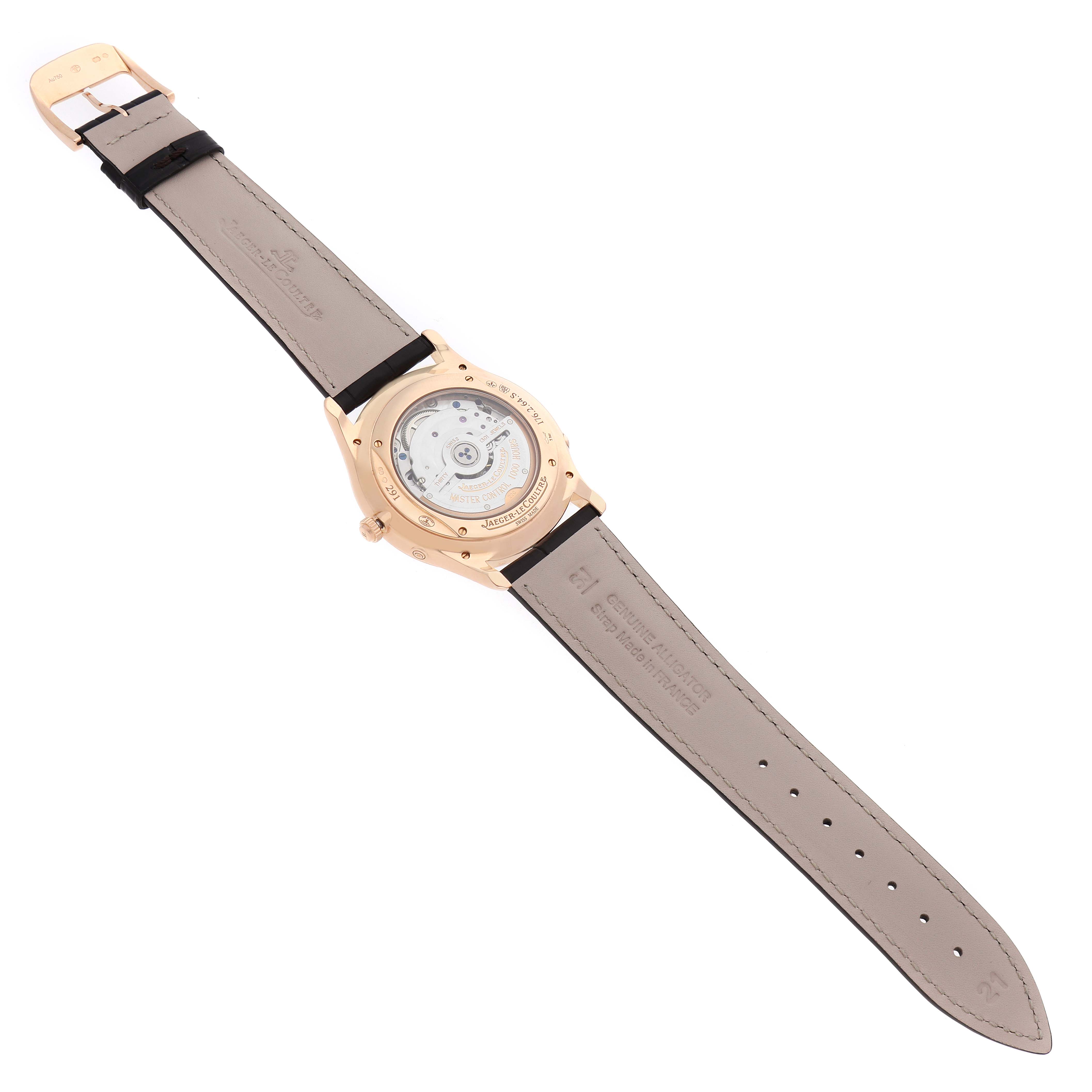 The image shows the back view of a Jaeger LeCoultre Master Q136256C Men's Rose Gold Brown Dial watch, highlighting the movement through a transparent case back.