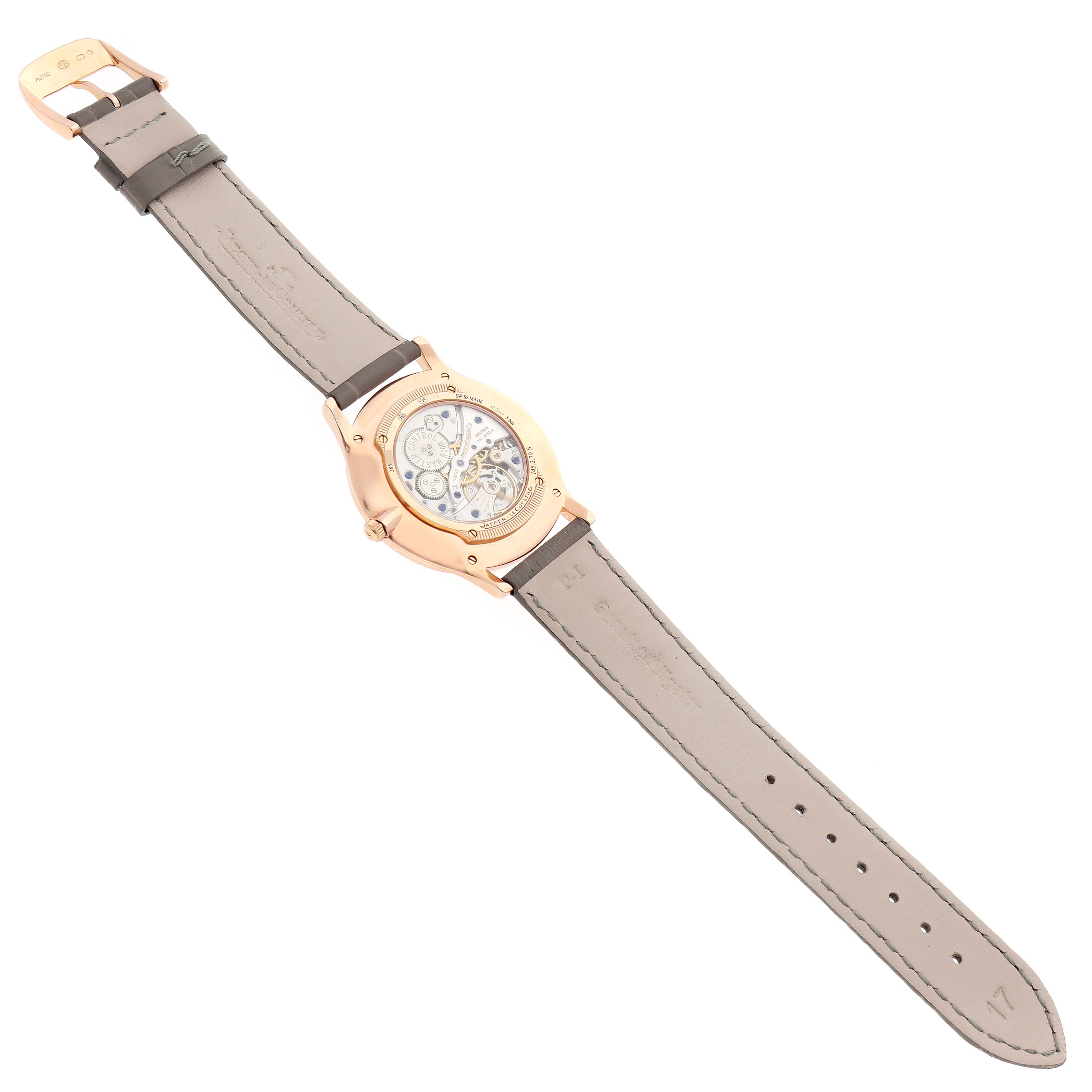 The Jaeger LeCoultre Master Q1452507 Women's Rose Gold Silver Dial model is shown from the back, displaying the movement and open leather strap.