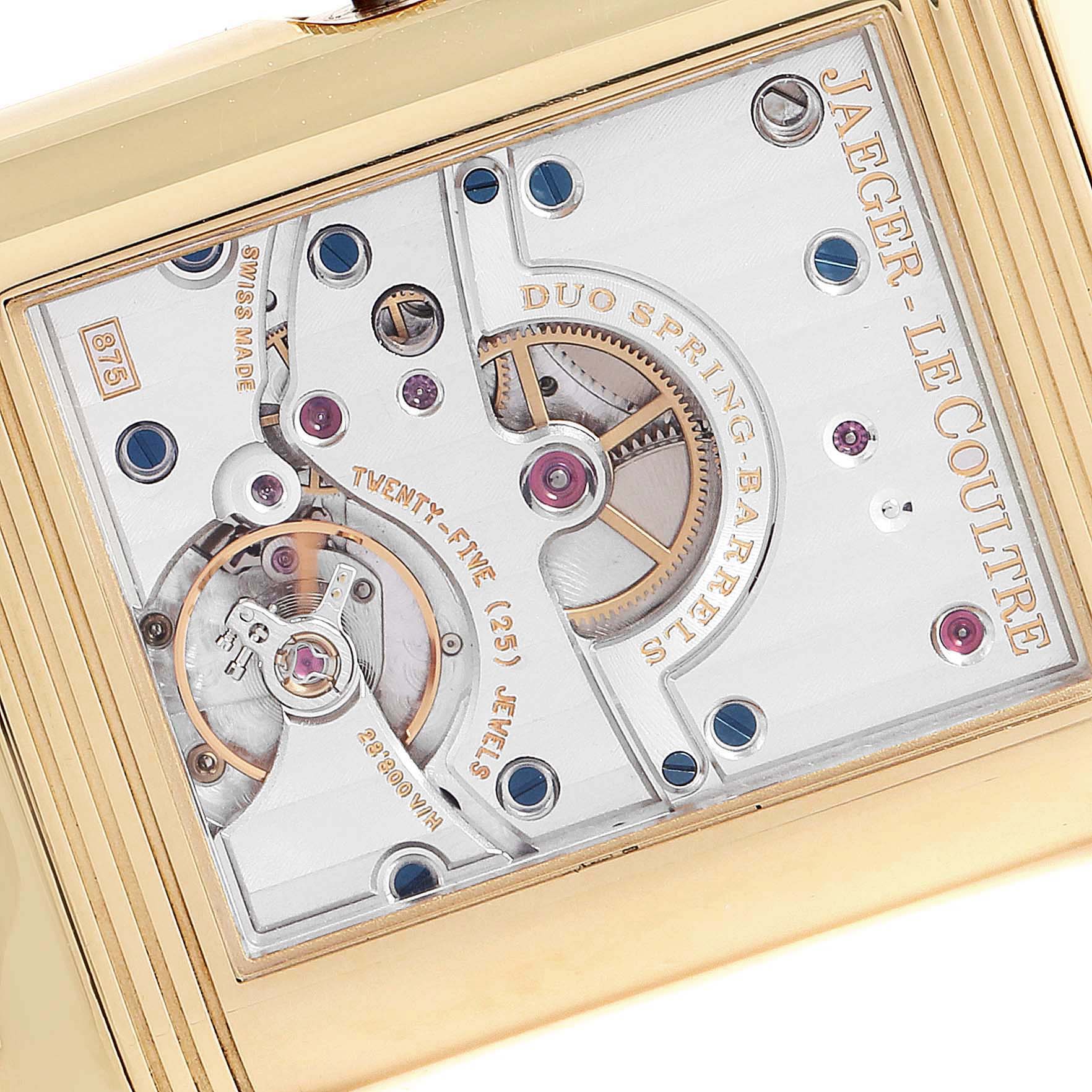 This close-up image shows the movement and inner workings of a Jaeger LeCoultre Reverso Q3001420 Men's Yellow Gold Silver Dial Q3001420 Men's Yellow Gold Silver Dial watch, highlighting the gears and inscriptions.