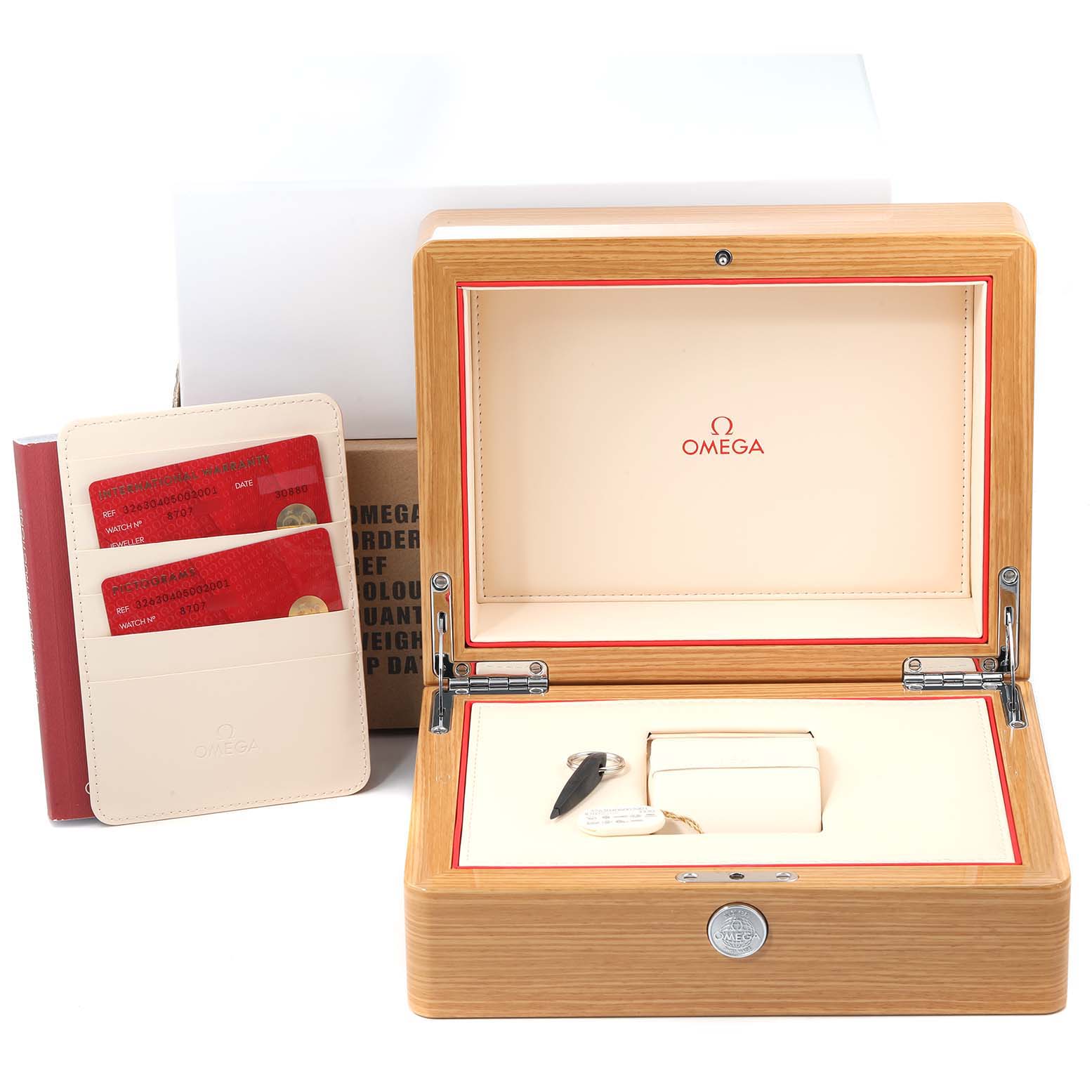 The image shows the Omega Speedmaster 326.30.40.50.02.001 Men
s Stainless Steel Silver Dial 326.30.40.50.02.001 Men
s Stainless Steel Silver Dial
s wooden presentation box, a cardholder with red cards, and a key-like accessory.