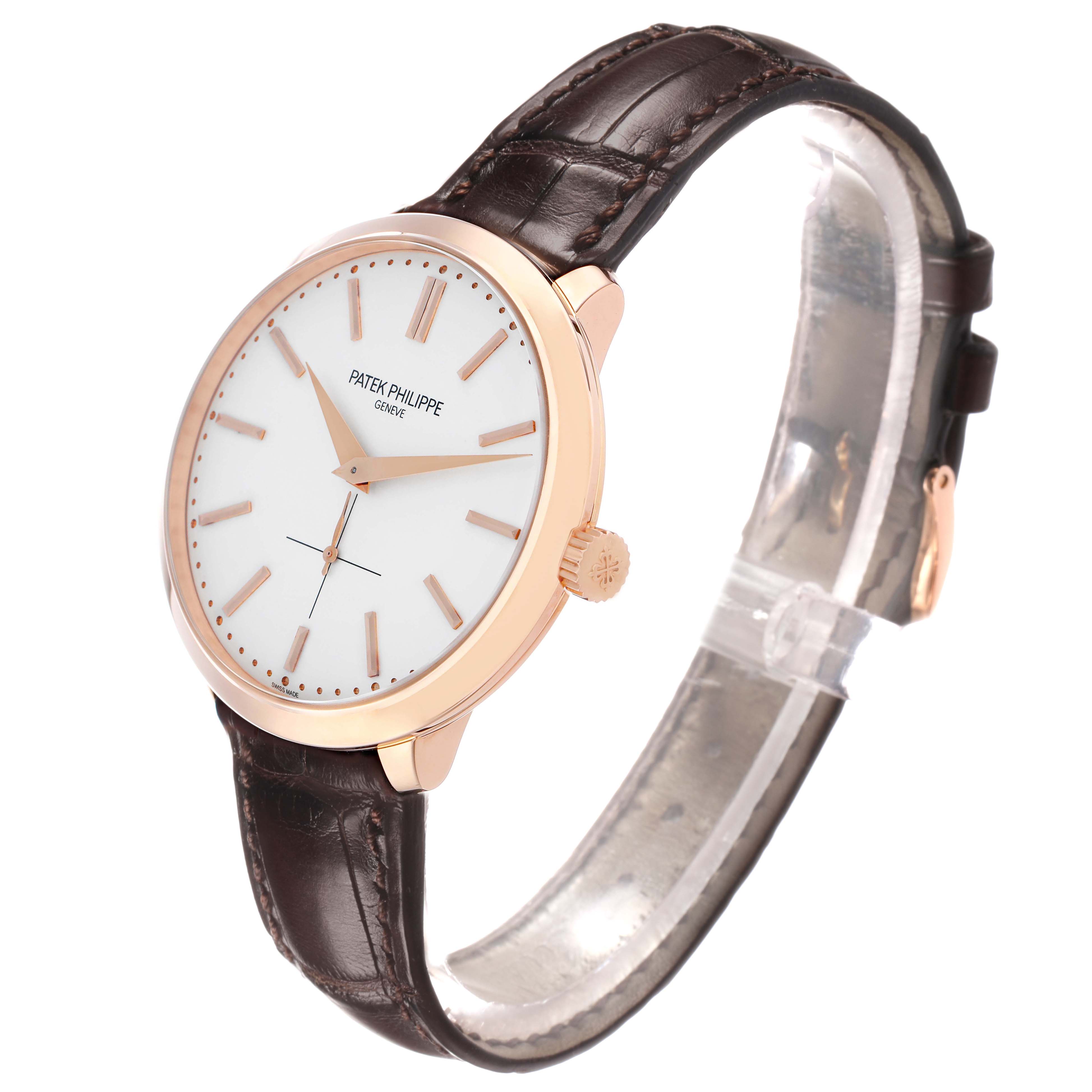 The Patek Philippe Calatrava 5123R Men's Rose Gold Silver Dial watch is shown at a three-quarter angle, highlighting its face, case, crown, and leather strap.