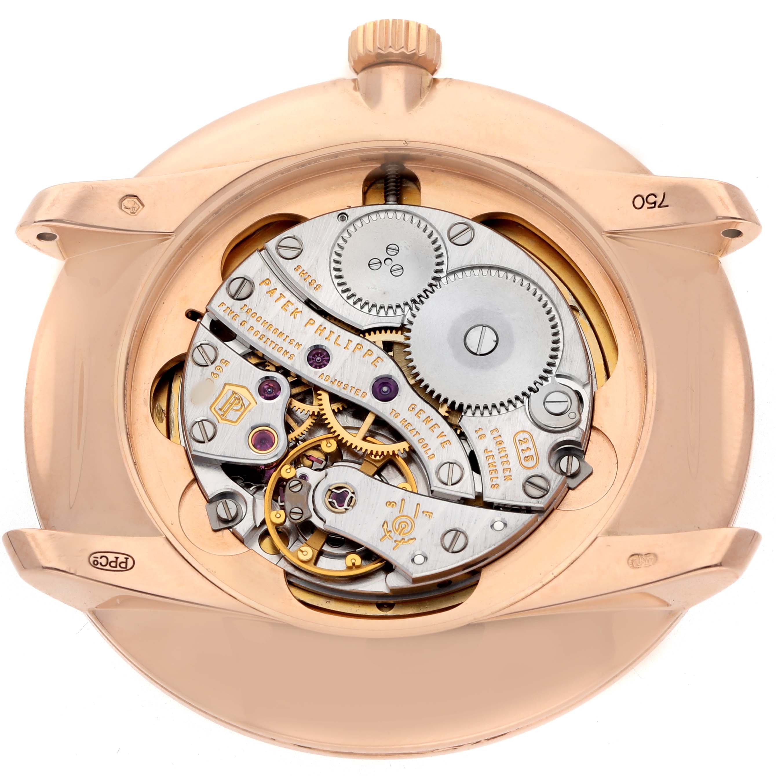 The image shows the back view of a Patek Philippe Calatrava 5123R Men's Rose Gold Silver Dial watch, displaying its intricate movement mechanism and gears.