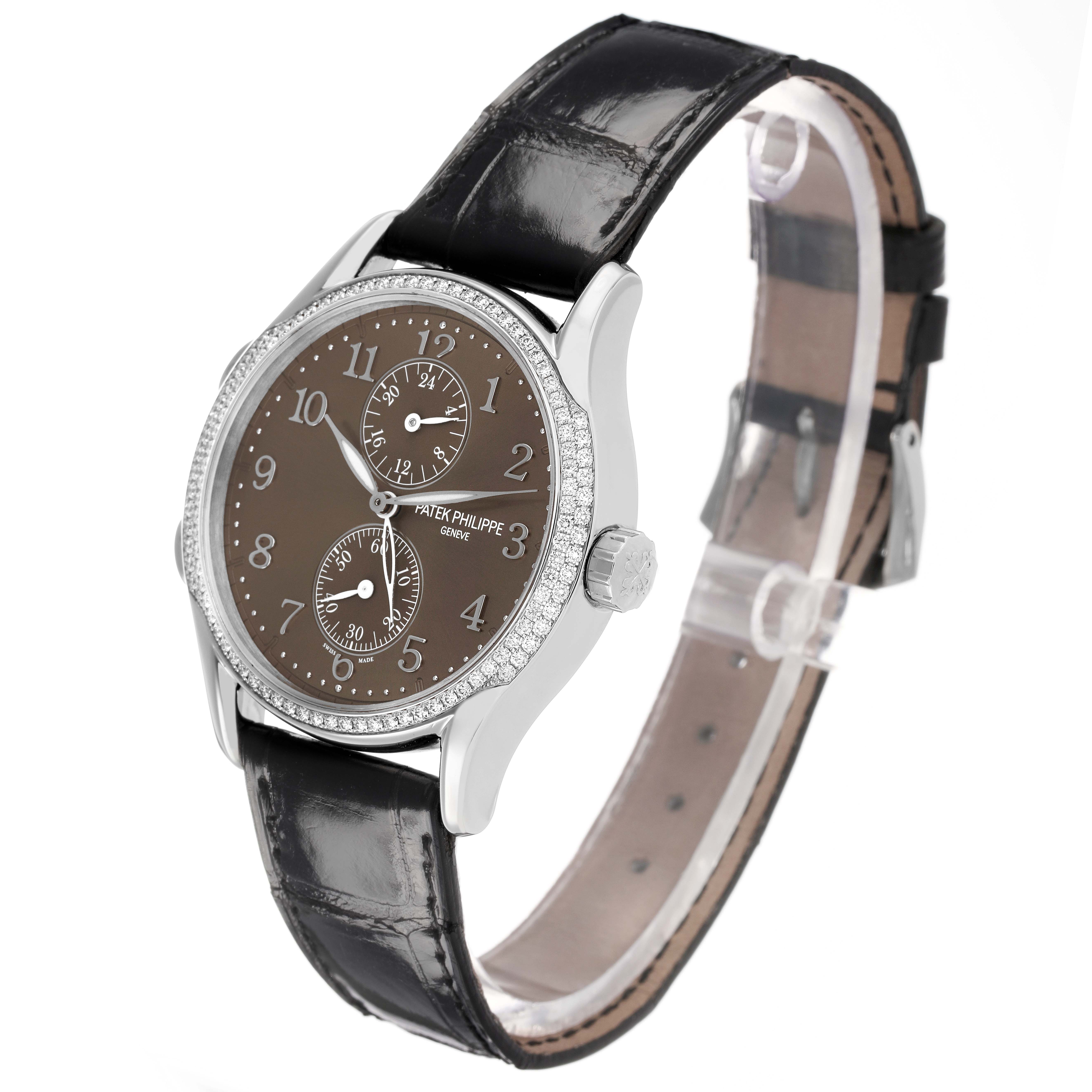 The Patek Philippe Calatrava 7134G Men's White Gold Brown Dial is shown at a three-quarter angle, displaying the dial, crown, and leather strap.