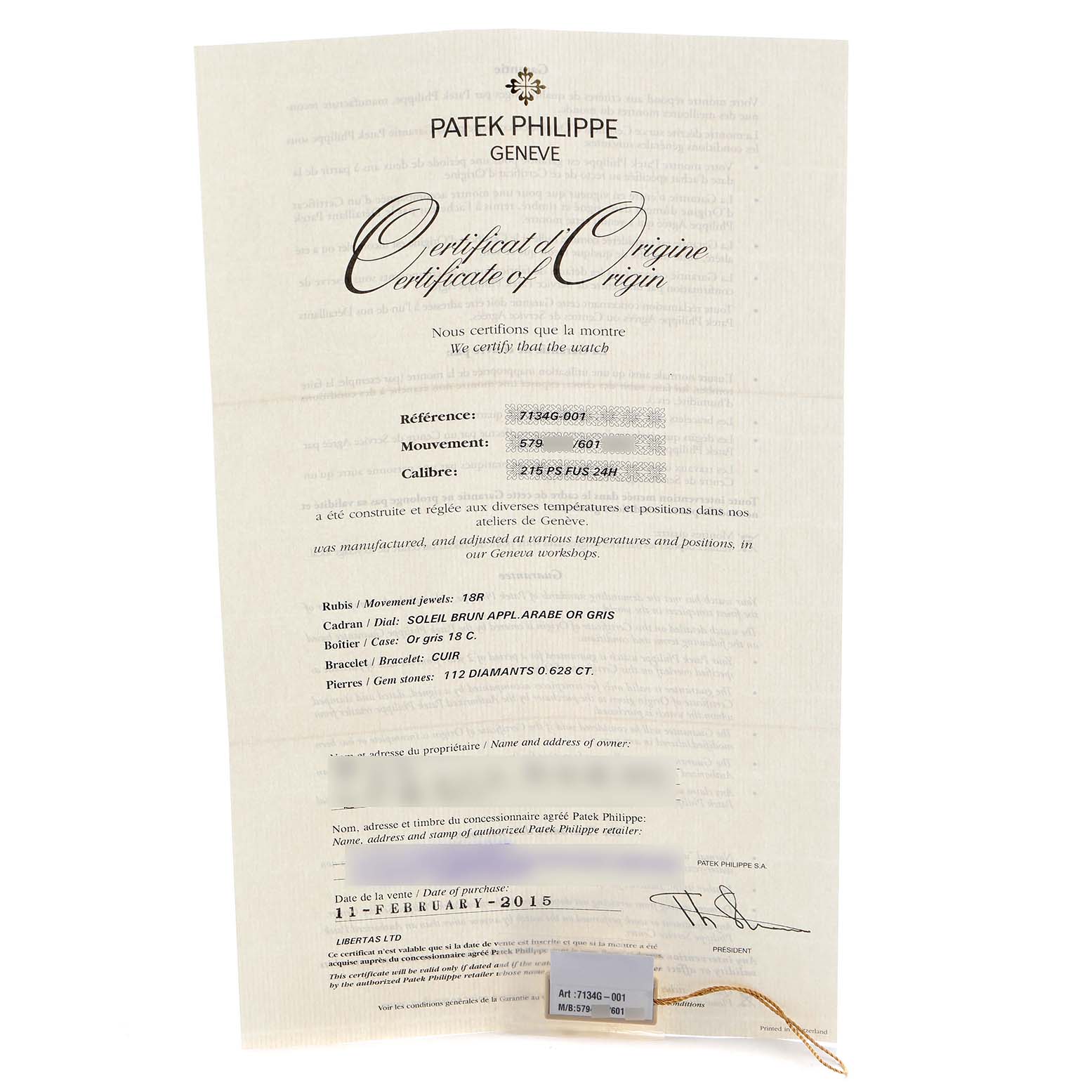 The image shows a Patek Philippe Calatrava 7134G Men's White Gold Brown Dial Certificate of Origin, focusing on the document details and a tag.