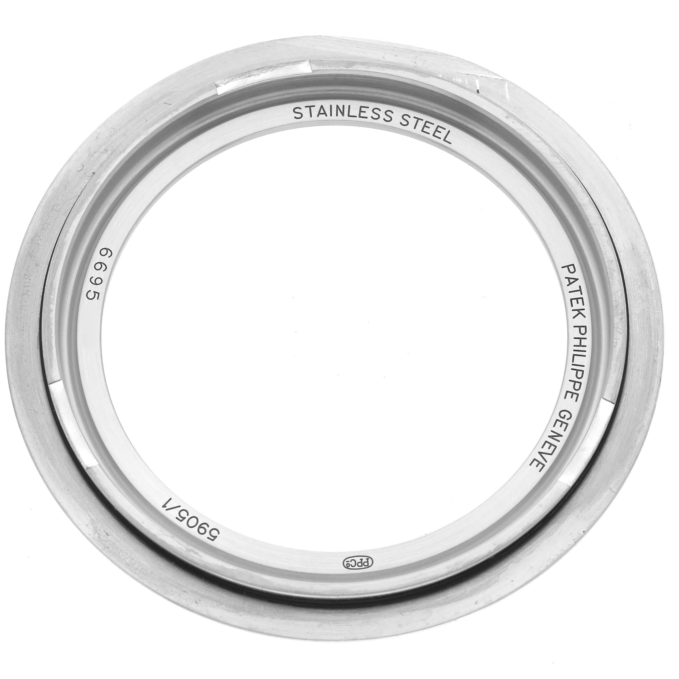 The image shows a Patek Philippe Complications 5905/1A-001 Men's Stainless Steel Green Dial 5905/1A-001 Men's Stainless Steel Green Dial watch bezel in stainless steel, viewed from above.