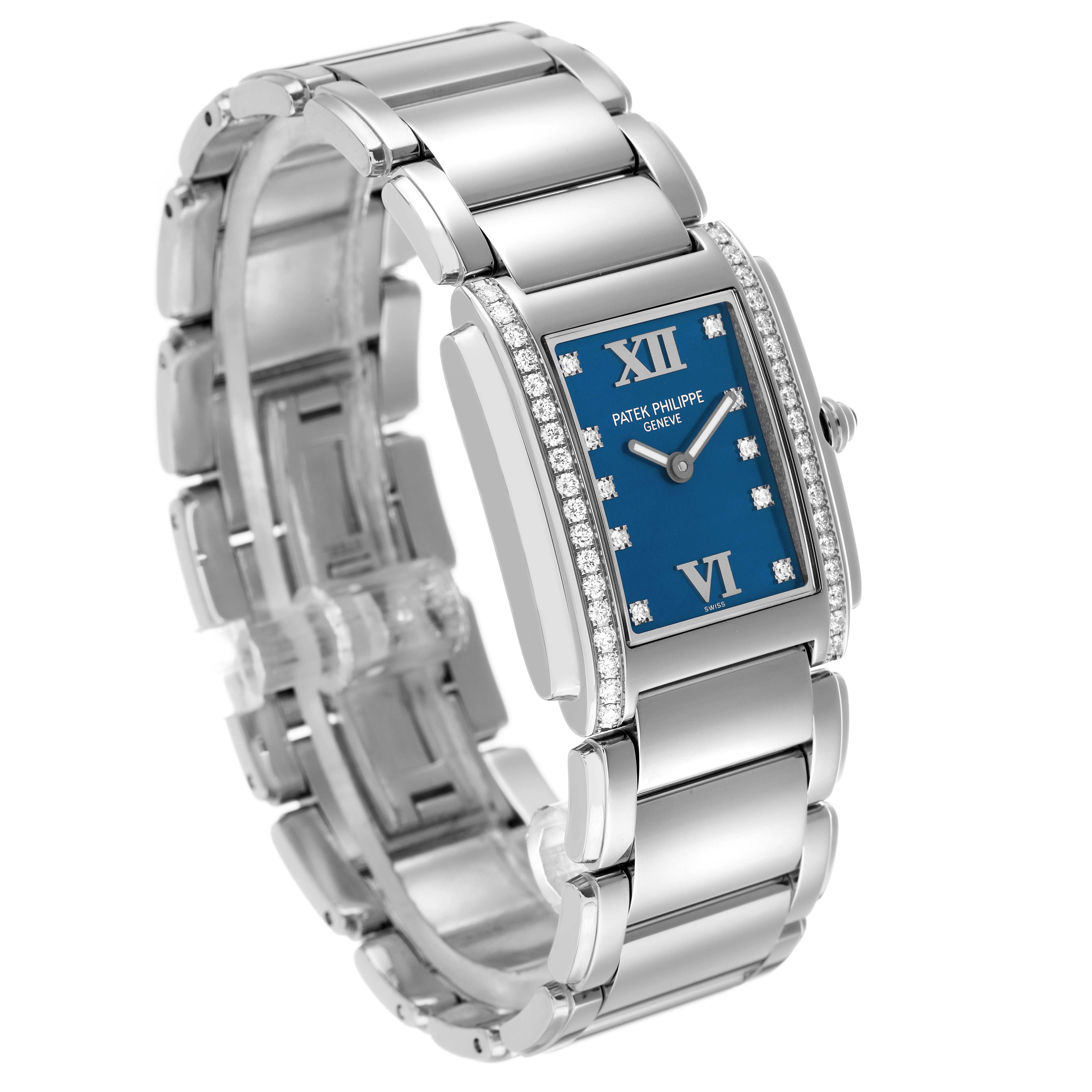 The Patek Philippe Twenty-4 4910/10A Women's Stainless Steel Blue Dial watch is shown at an oblique angle, highlighting the blue dial, diamond bezel, and metal bracelet.