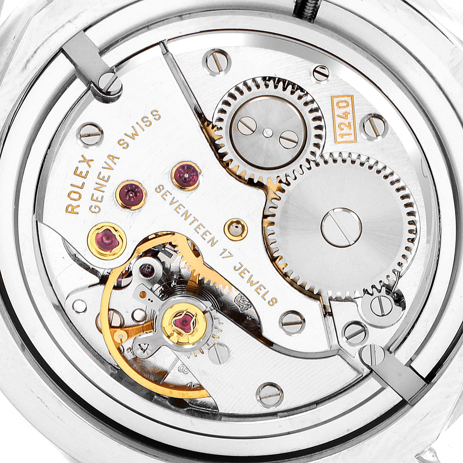 This image shows a close-up view of the Rolex Cellini 5240 Men's Platinum Mother of Pearl Dial 5240 Men's Platinum Mother of Pearl Dial watch movement, highlighting the gears and jewel bearings.