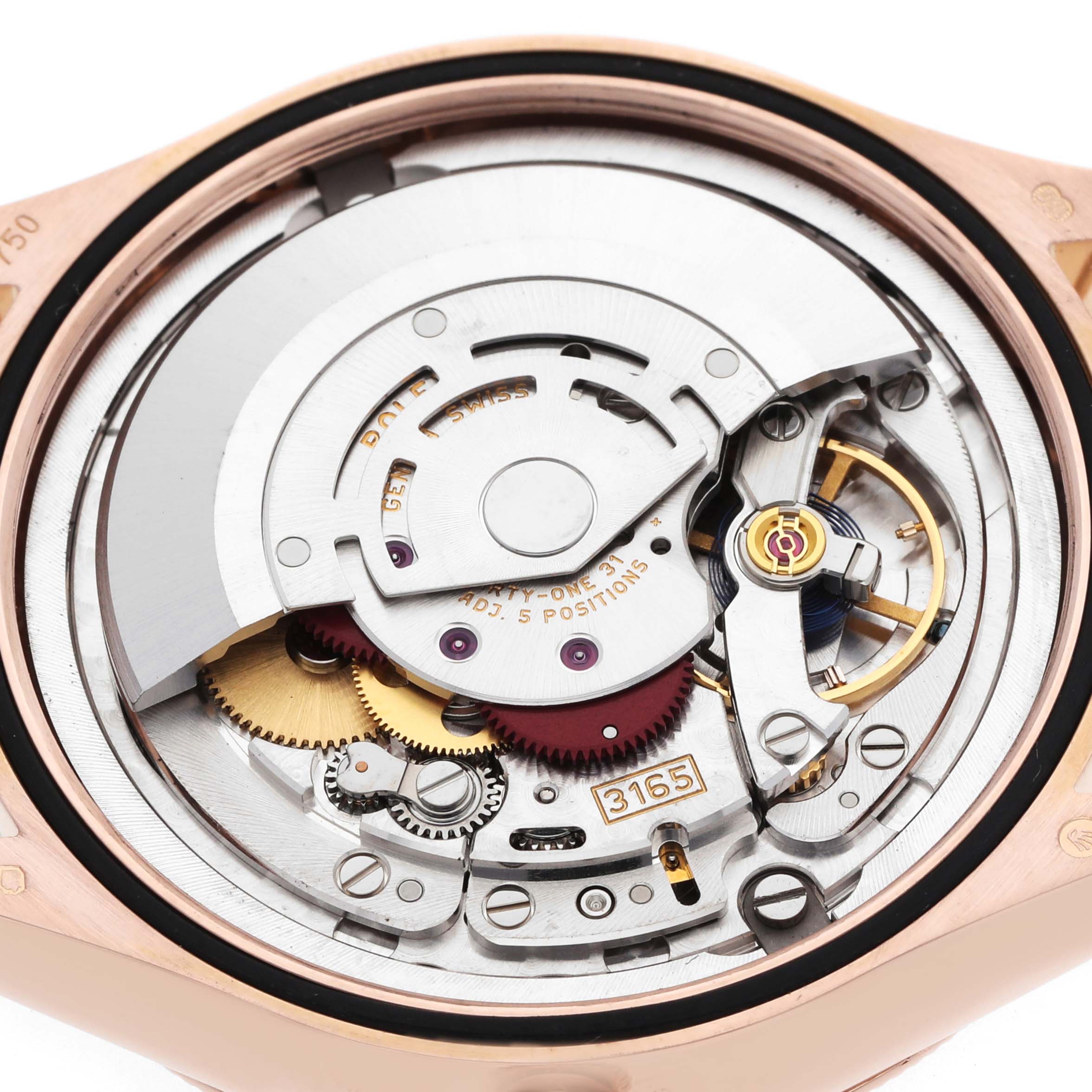 The image shows a detailed view of the movement from the back of a Rolex Cellini 50515 Men's Rose Gold Black Dial watch, focusing on the intricate gears and rotor.