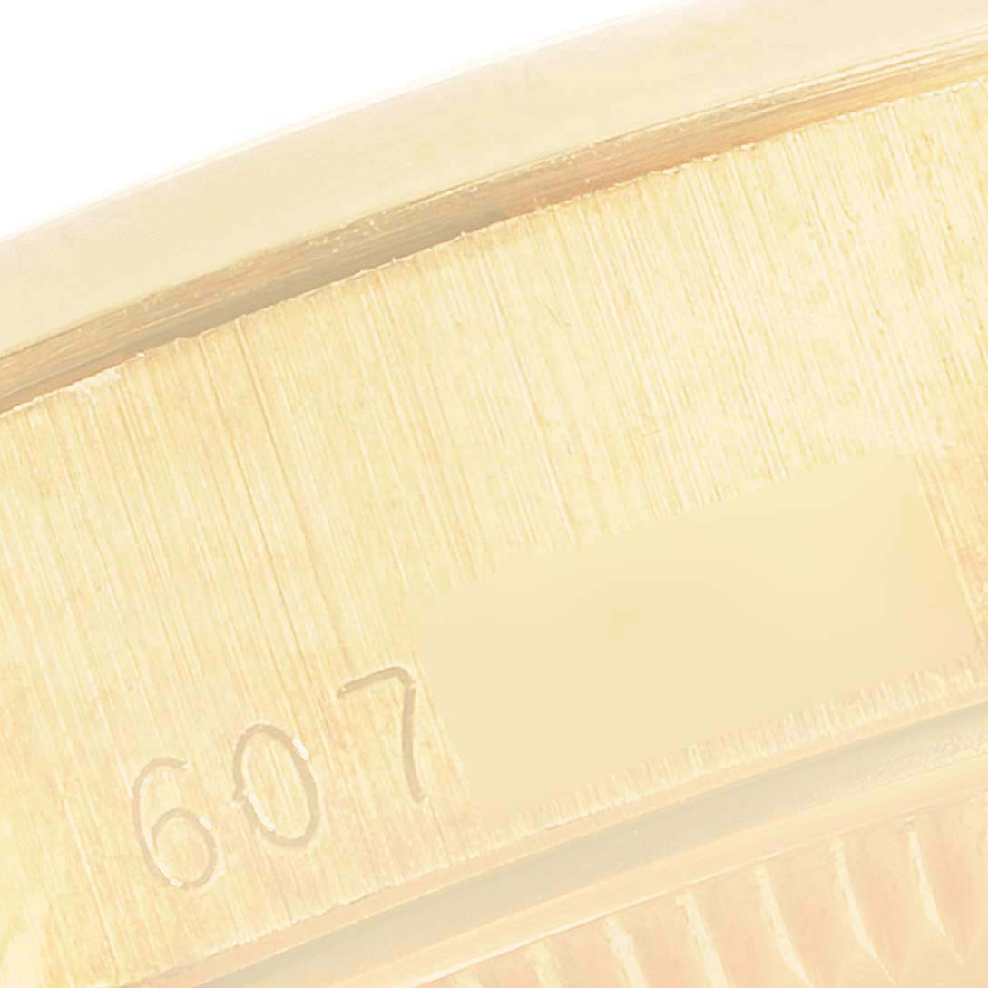 This close-up image of the Rolex President 6916 Women
s Stainless Steel White Dial 6916 Women
s Stainless Steel White Dial model shows the engraved serial number on the side of the watch case.