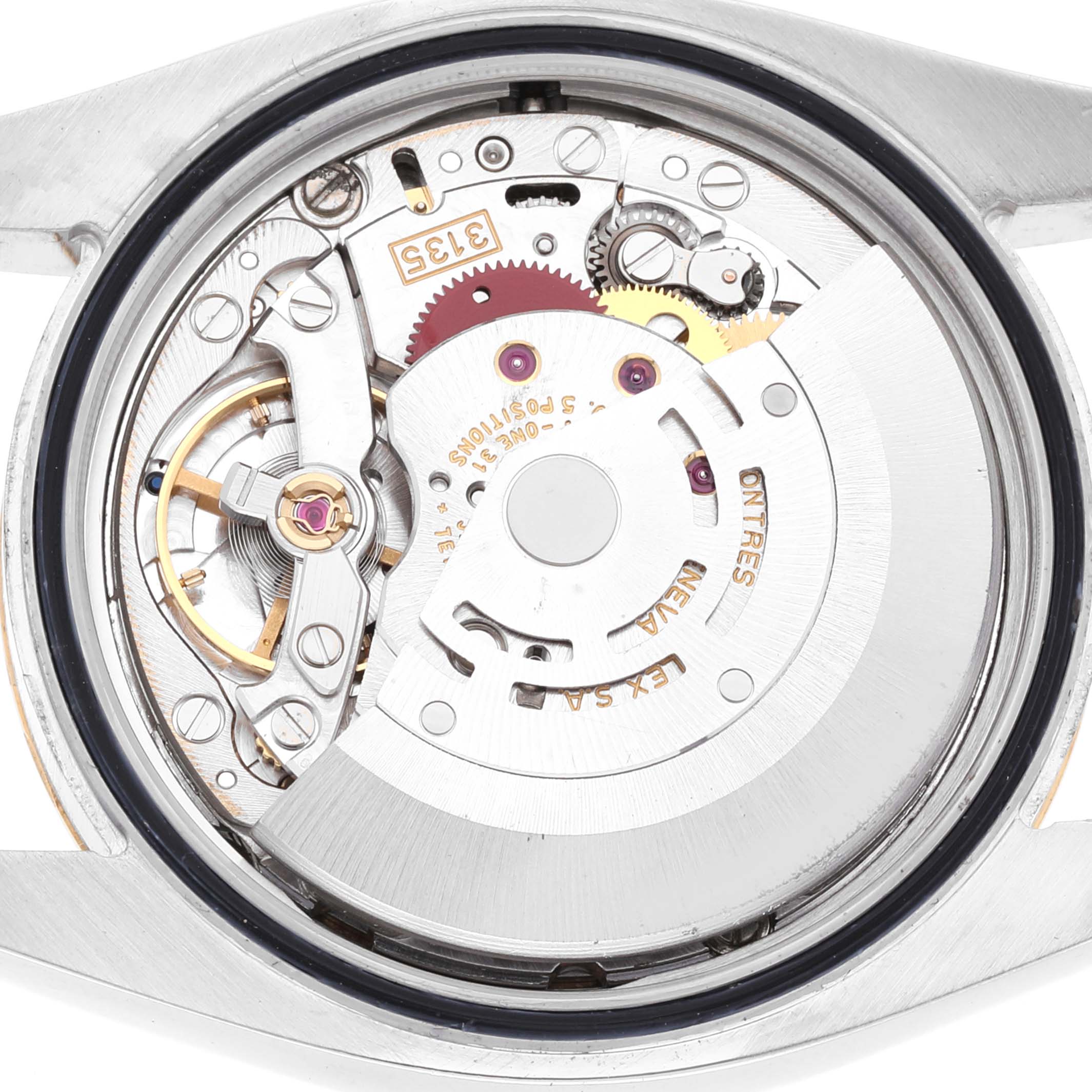 This image shows the internal movement assembly of the Rolex Datejust 116233 Men's Steel and Gold (two tone) Champagne Dial 116233 Men's Steel and Gold (two tone) Champagne Dial watch from the back, revealing its intricate components.