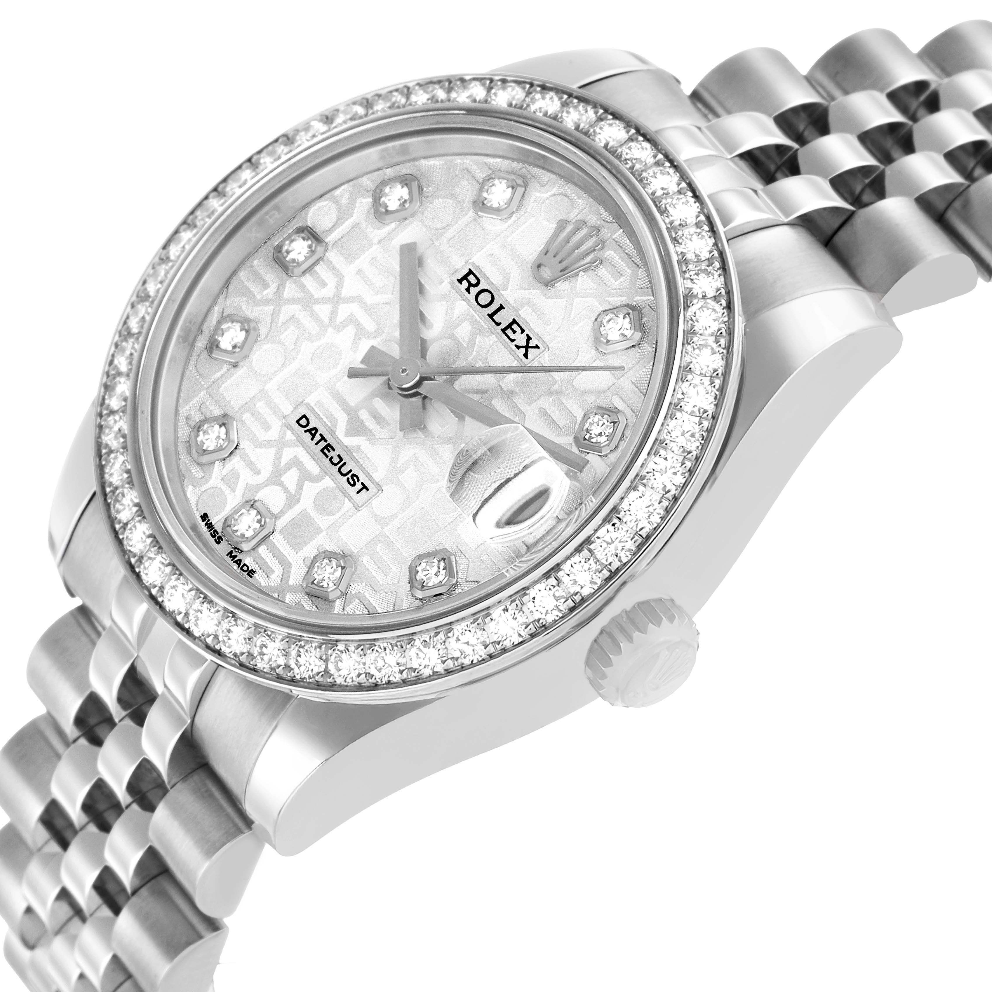 The Rolex mid-size watch is shown from a tilted angle, displaying its diamond bezel, dial, crown, and partial bracelet.