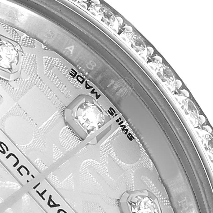 The image shows a close-up of the Rolex Mid-Size 178384 Women's Stainless Steel Silver Dial watch face, highlighting the diamond markers and part of the bezel.