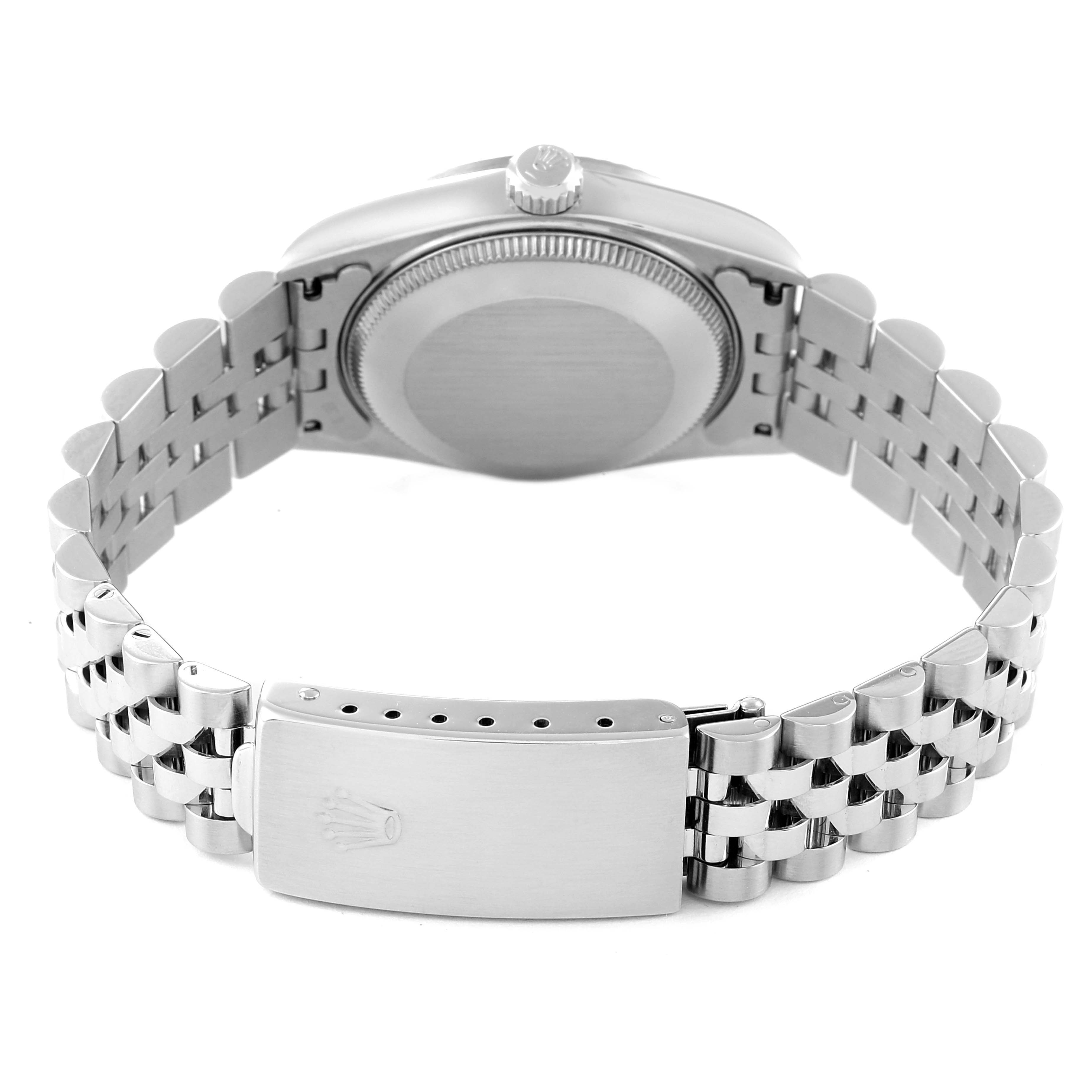 This image shows the back case and bracelet clasp of a Mid-Size Rolex model watch, viewed from the backside.