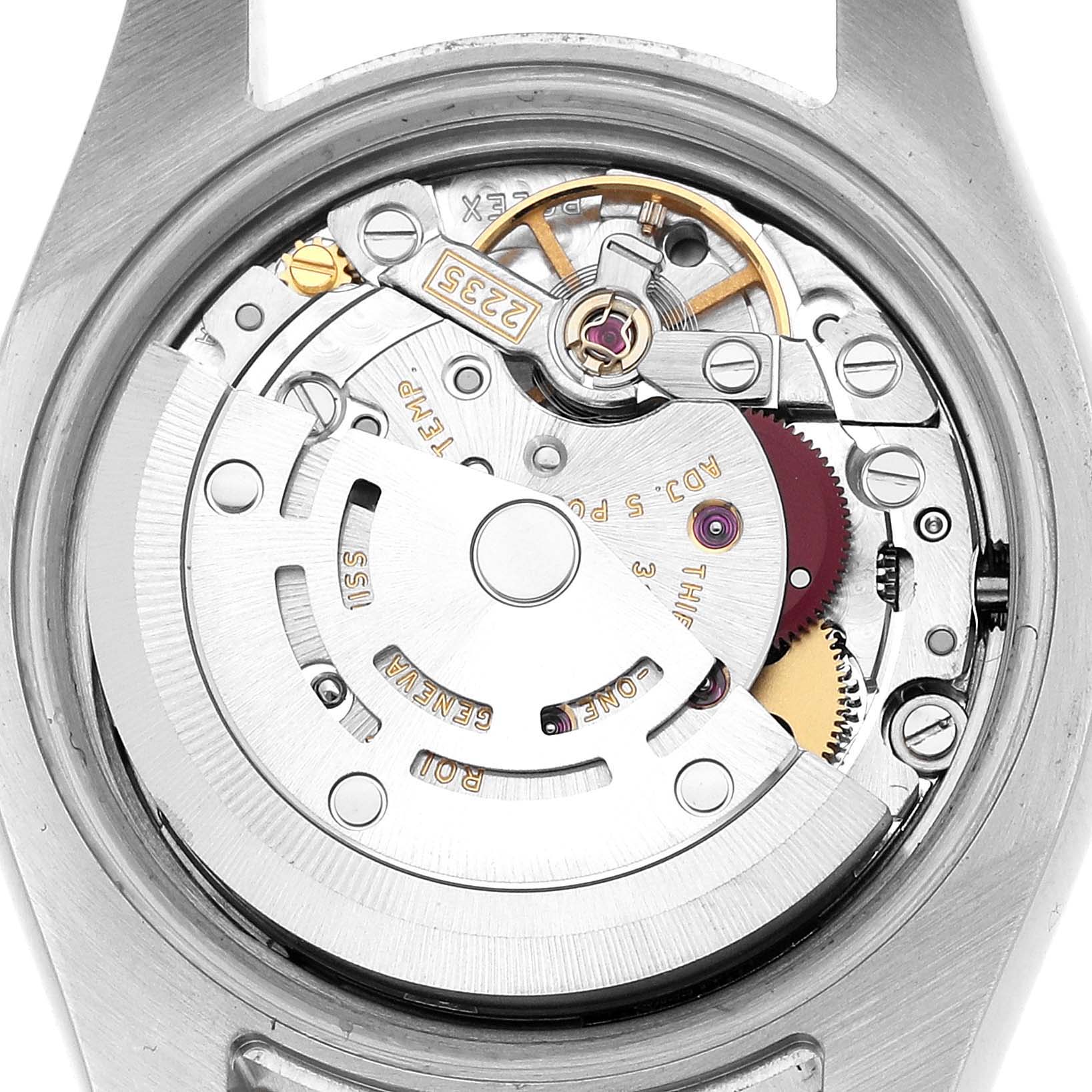 The image shows the movement of a Rolex Datejust 179171 Women's Stainless Steel Silver Dial, viewed from the back, revealing gears and mechanical components.